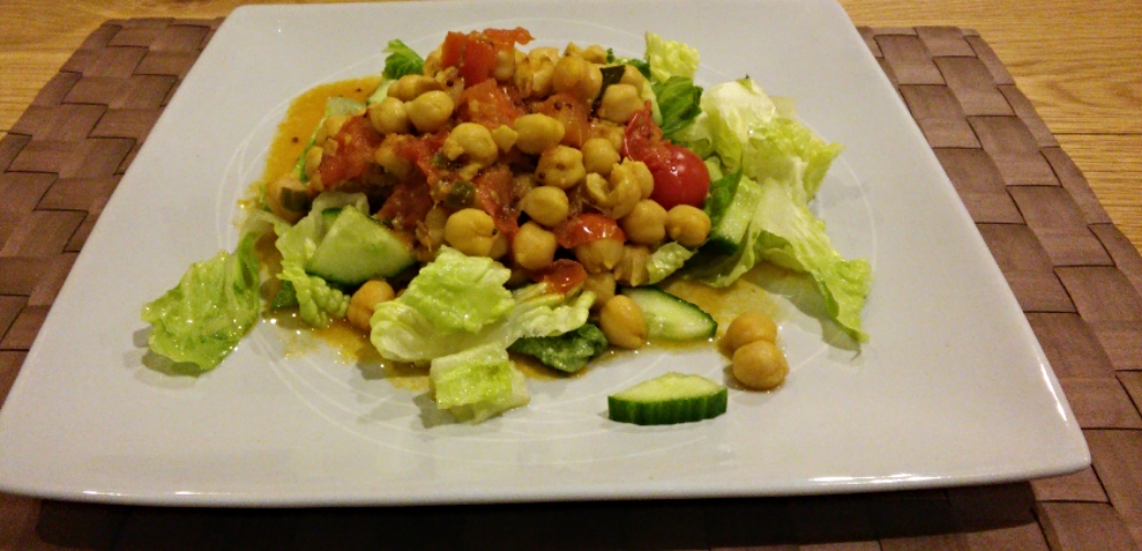 Tasty chickpeas on a bed of salad
