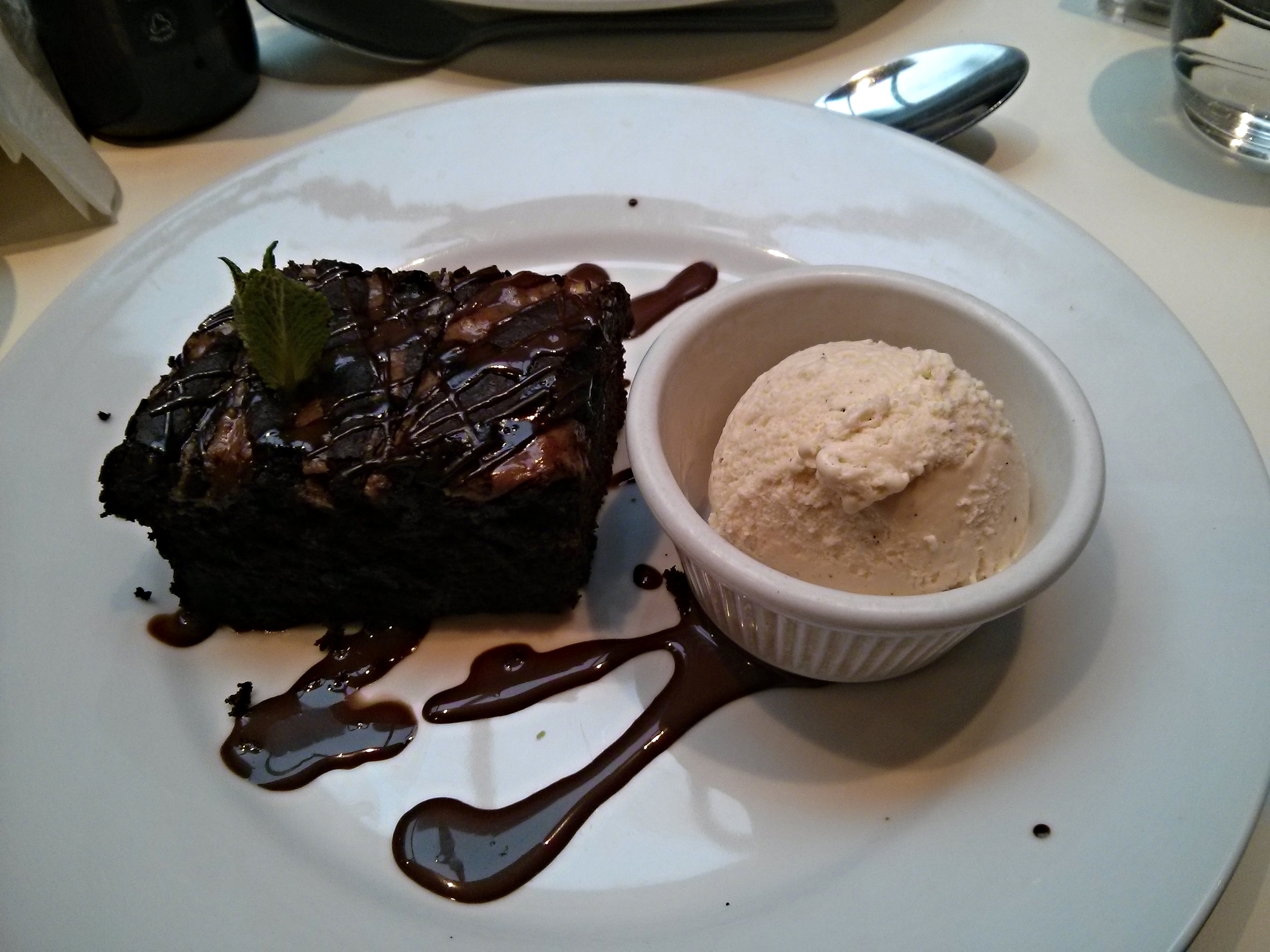 Chocolate and peanut butter brownie with chocolate sauce and vanilla ice cream