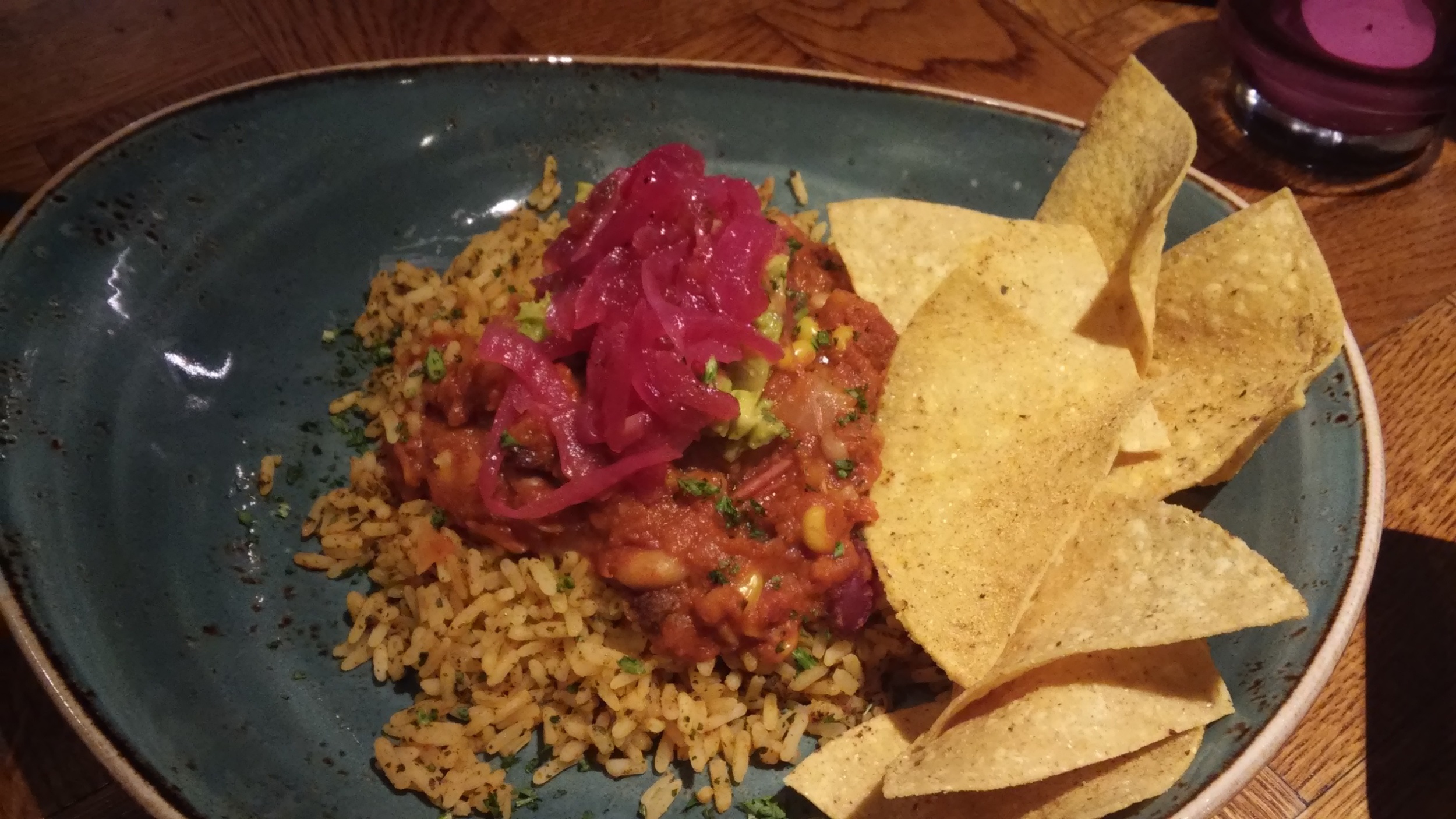 Veggie five bean chilli served with Mexican spiced rice, roasted vegetables and tortilla chips