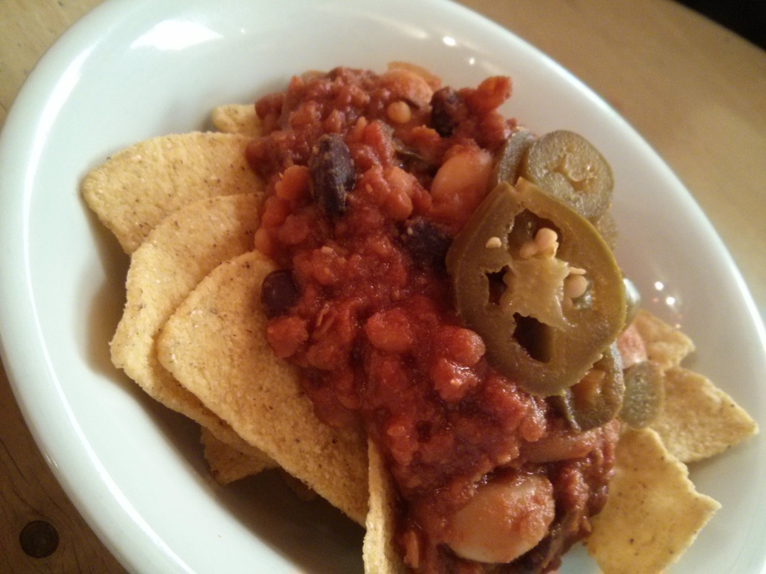 Kid size portion of nachos with meatless chilli