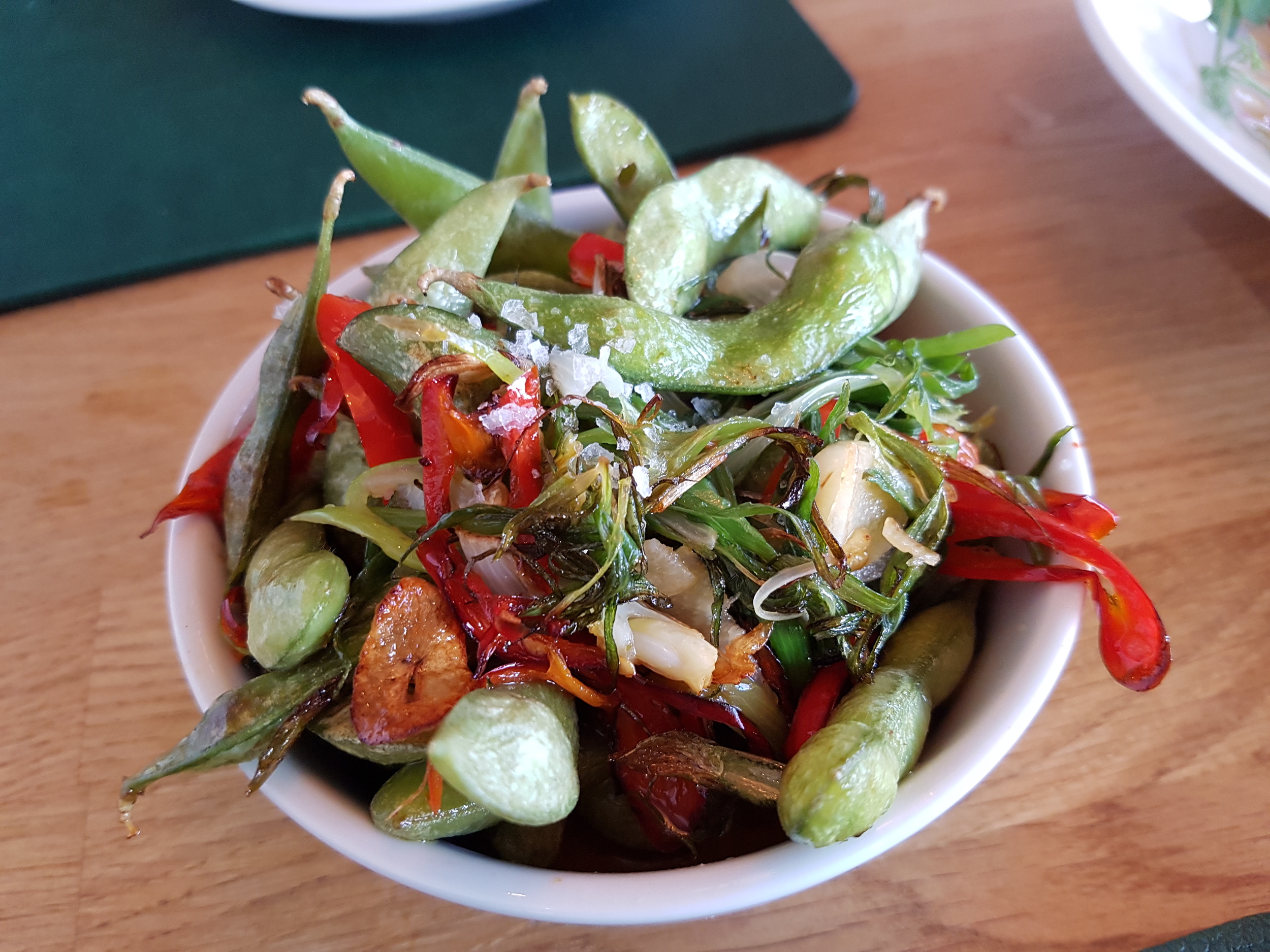 Edamame beans toasted in garlic, red chili and rock salt