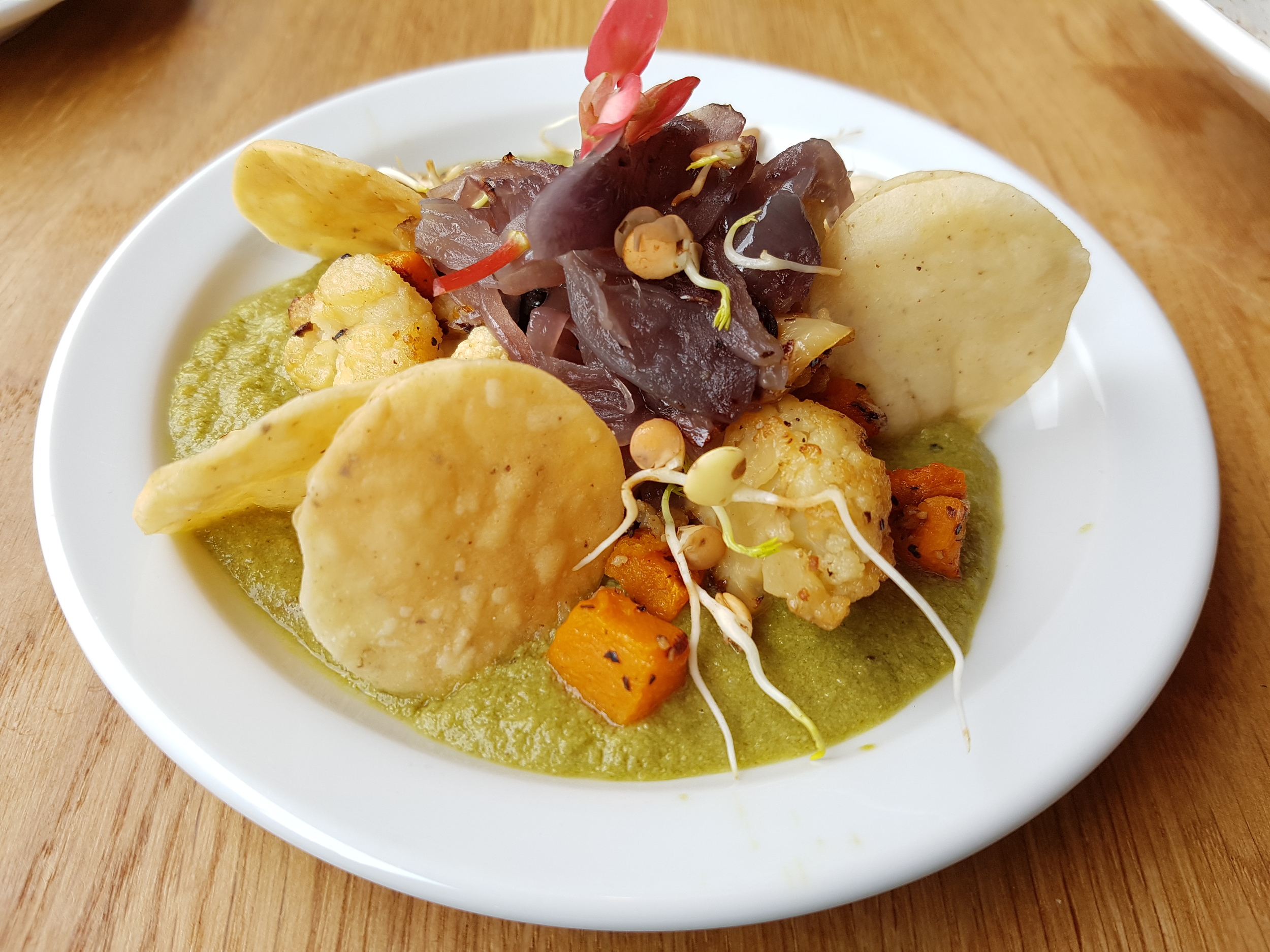 Pipian Mole: Green tomato and nut sauce, served with roasted squash and cauliflower, topped with caramelised onions