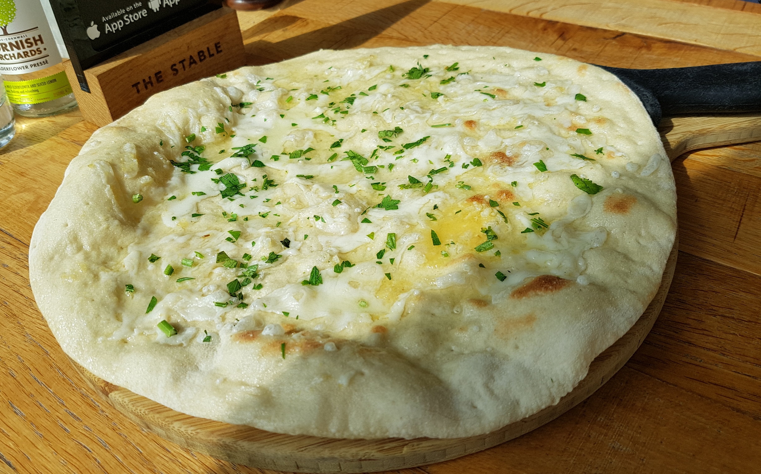 Garlic Bread | sourdough pizza base, brushed with garlic oil , chopped parsley and vegan cheese