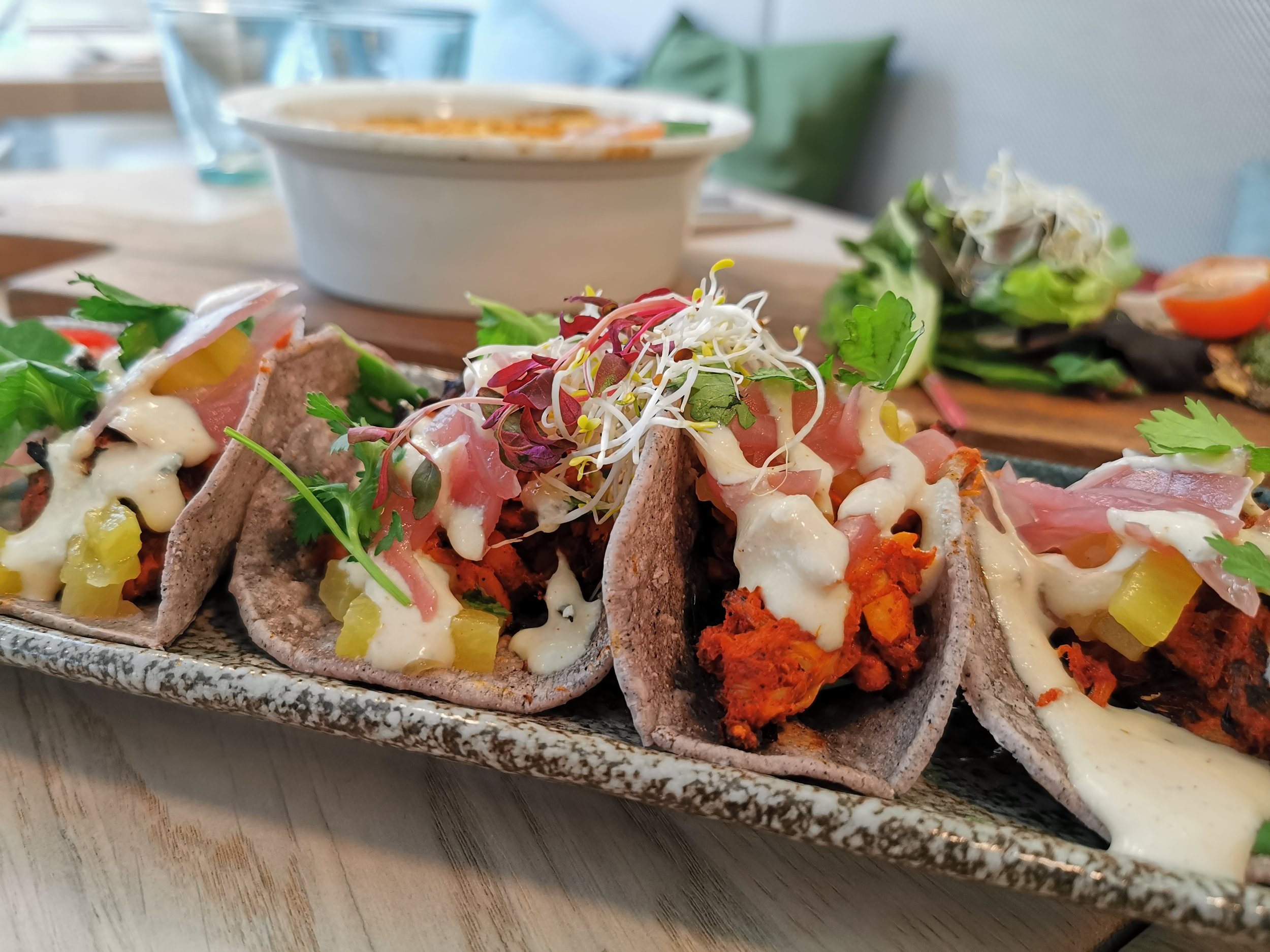 Stem + Glory: Blue Corn Tacos - marinated pulled jackfruit, achiote sauce, chili juagillo, pineapple kimchi, pickled red onion  