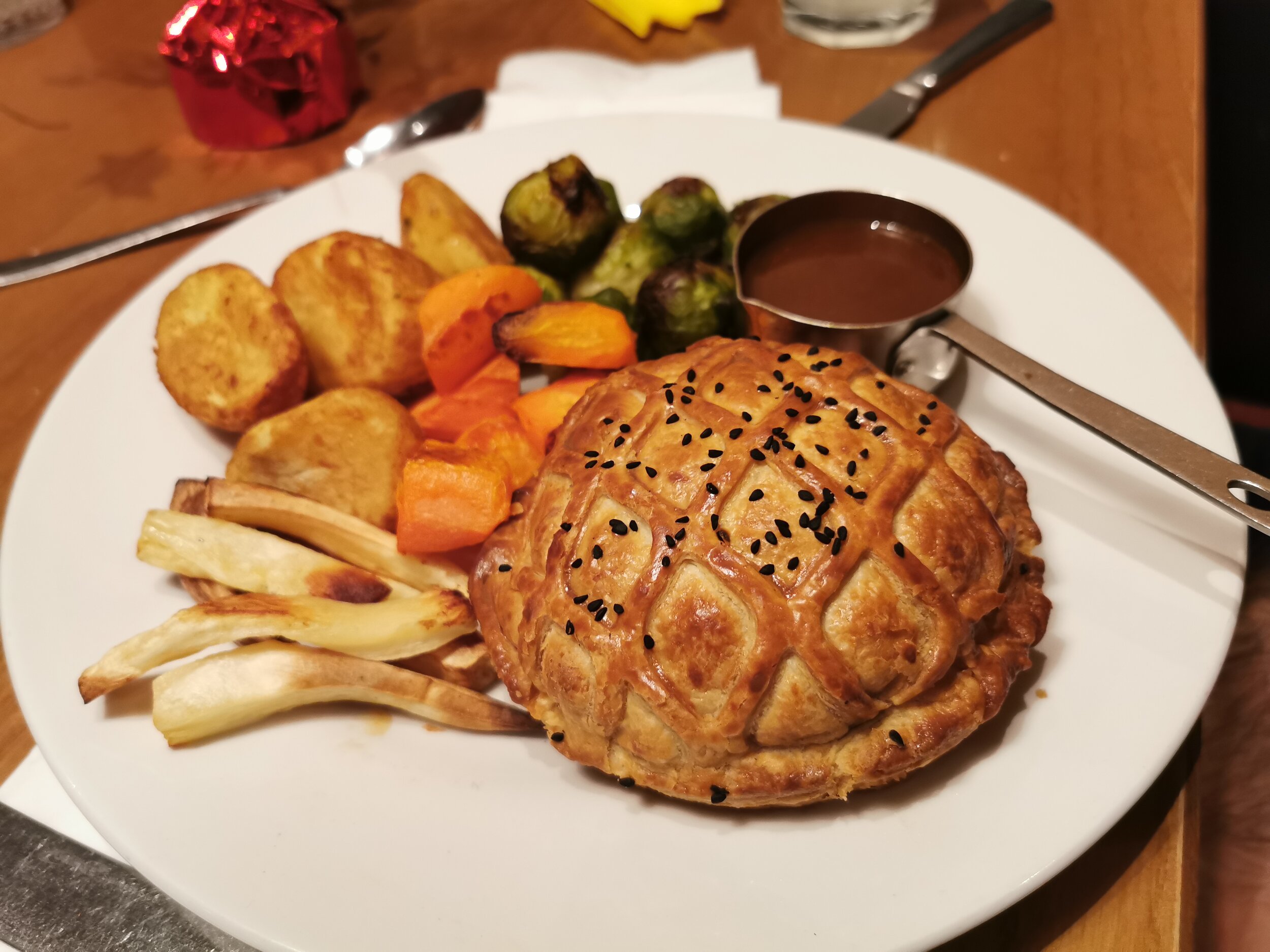 Vegan Wellington: butternut squash, sage &amp; caramelised onion wrapped in flaky pastry, served with seasonal vegetables, roast potatoes and vegan gravy