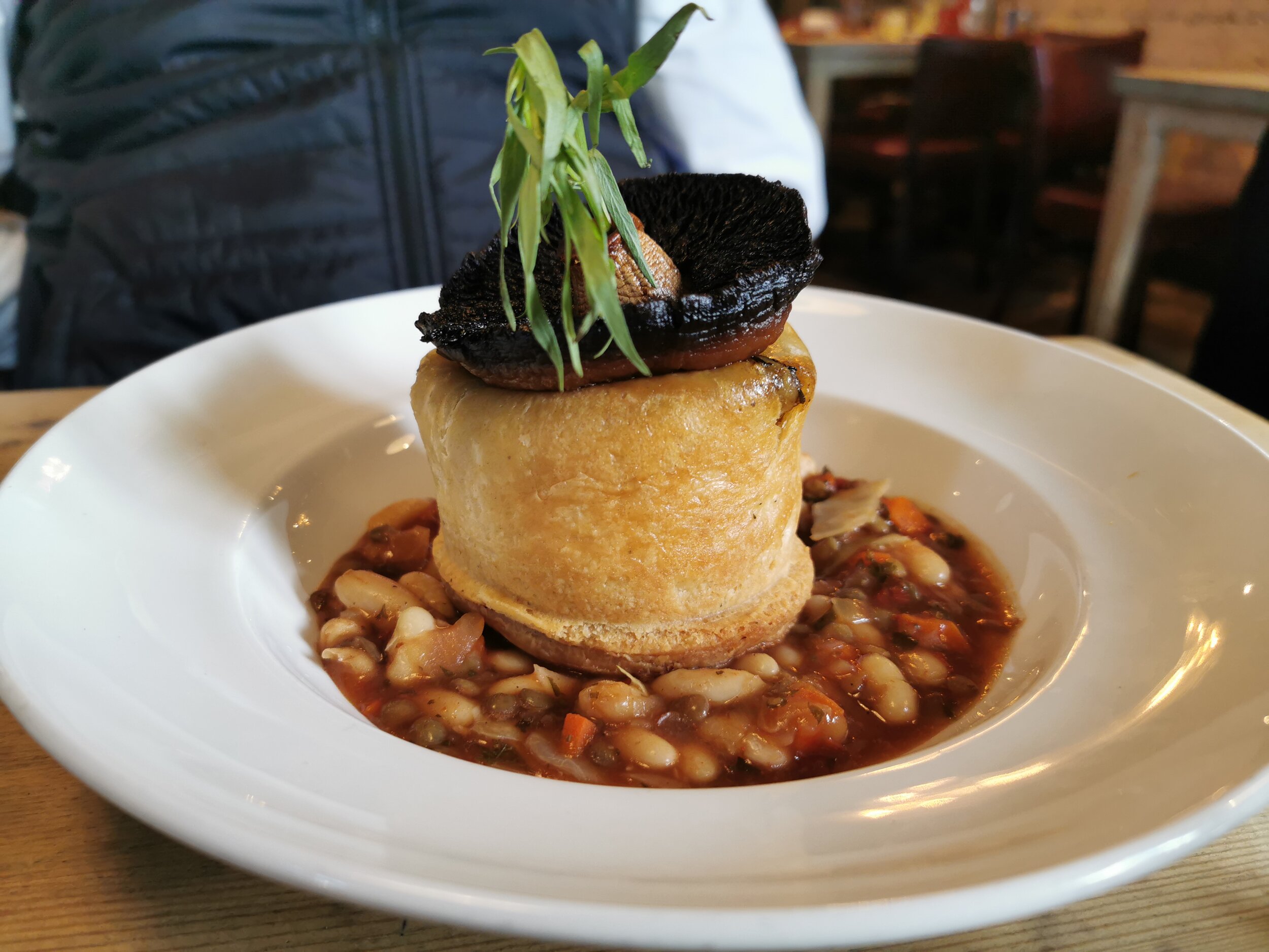 Mushroom and Tarragon Suet Pudding with a roasted mushroom, parsley &amp; white bean cassoulet