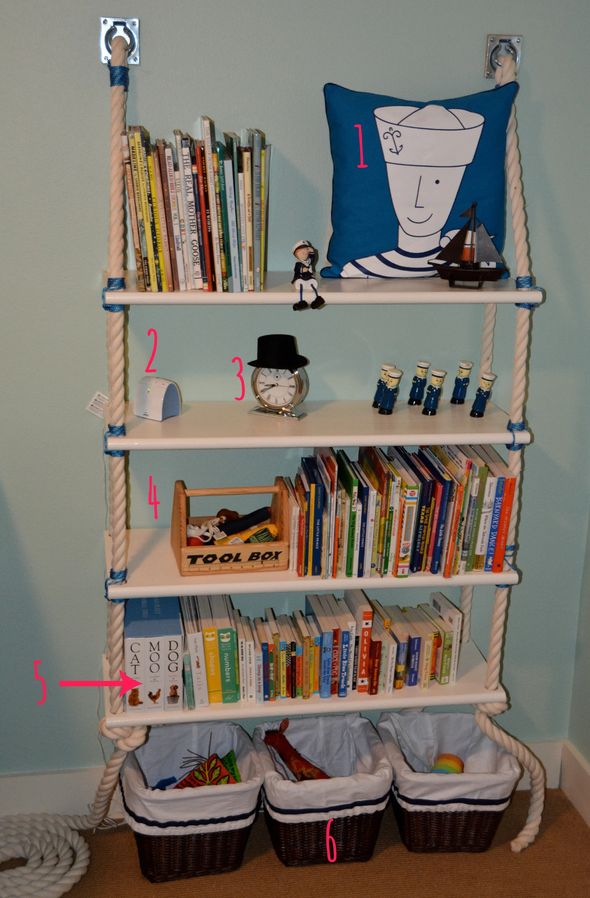 The rope on the bookcase adds a fun twist without being too kitschy. 