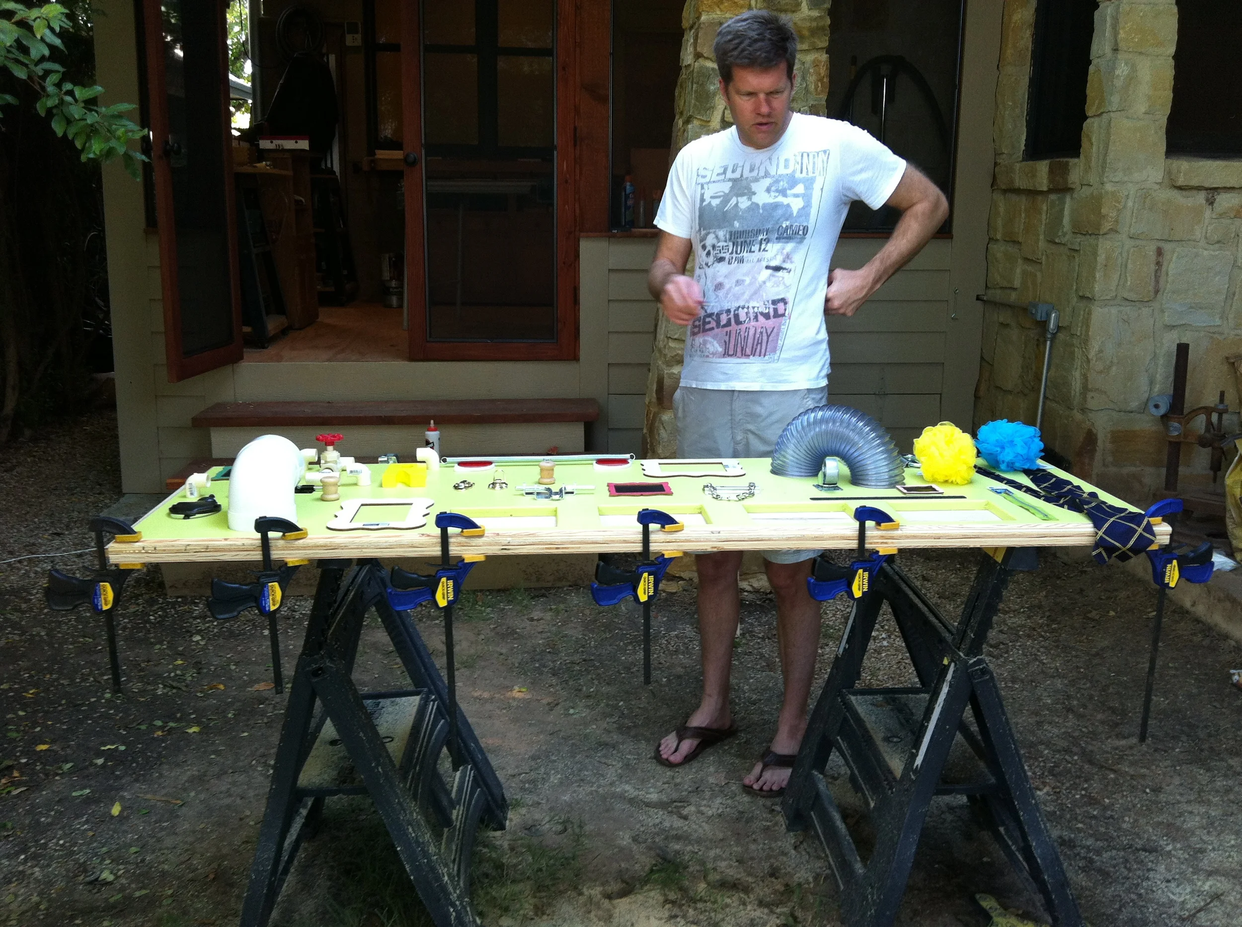 Jon contemplates our layout while the wood glue for the frame dries.