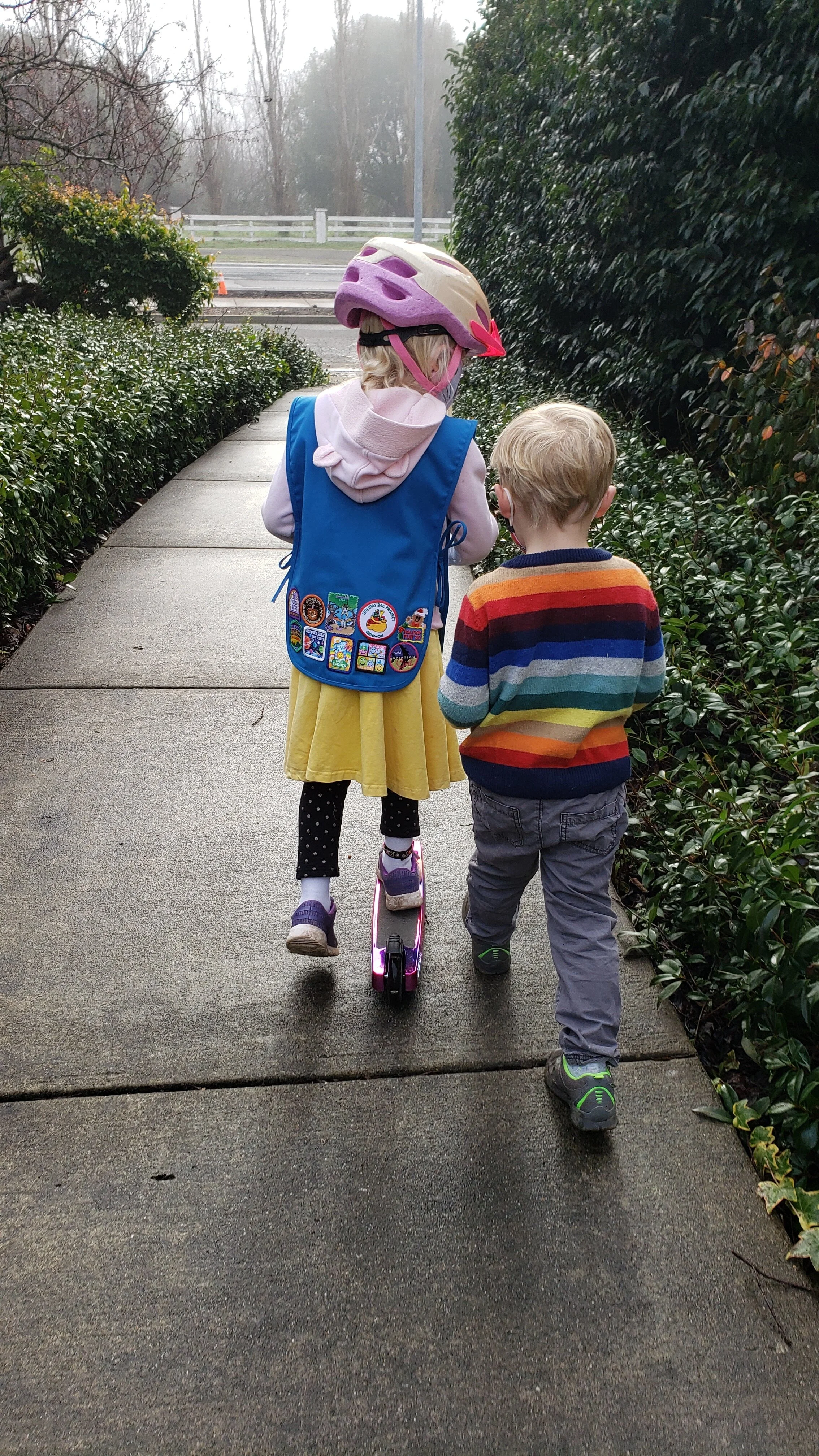 Anna’s daughter, a first year Daisy Girl Scout, and son heading out to distribute flyers for contactless cookie sales in January 2021