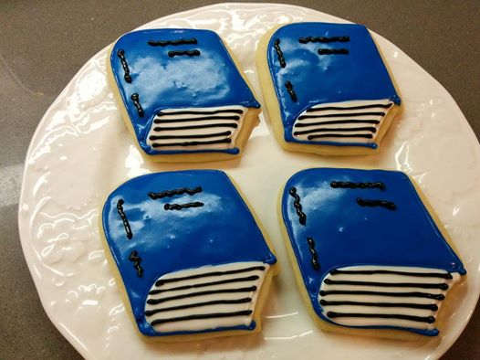 Blue Baker cookies in the shape of books! All proceeds go to Books and a Blanket.