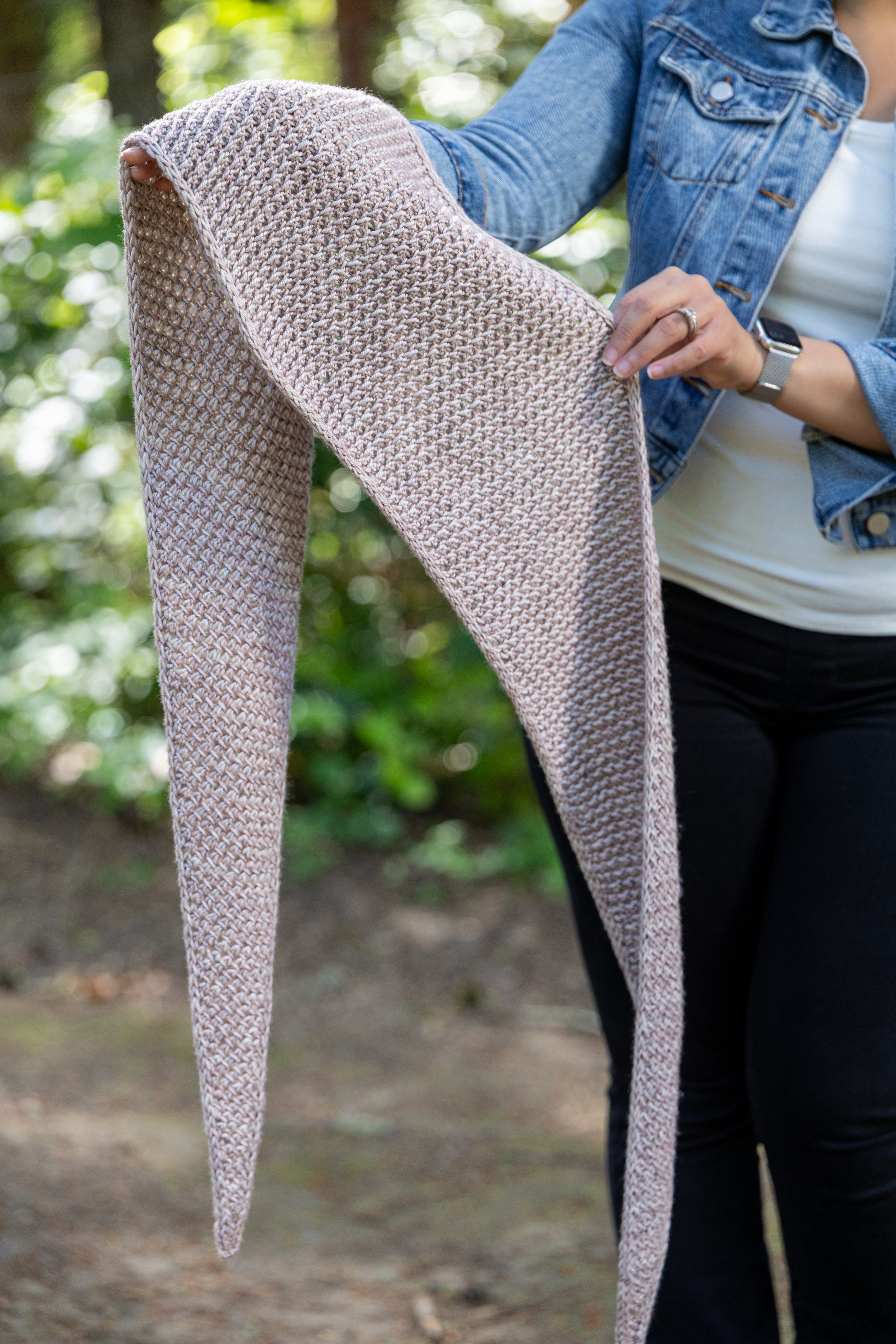 Don't worry about hiding the wrong side in the Tipping Point Scarf, a small triangular shawl knit sideways from end to end in a reversible textured lace stitch framed by tidy, 3-stitch i-cord edges.