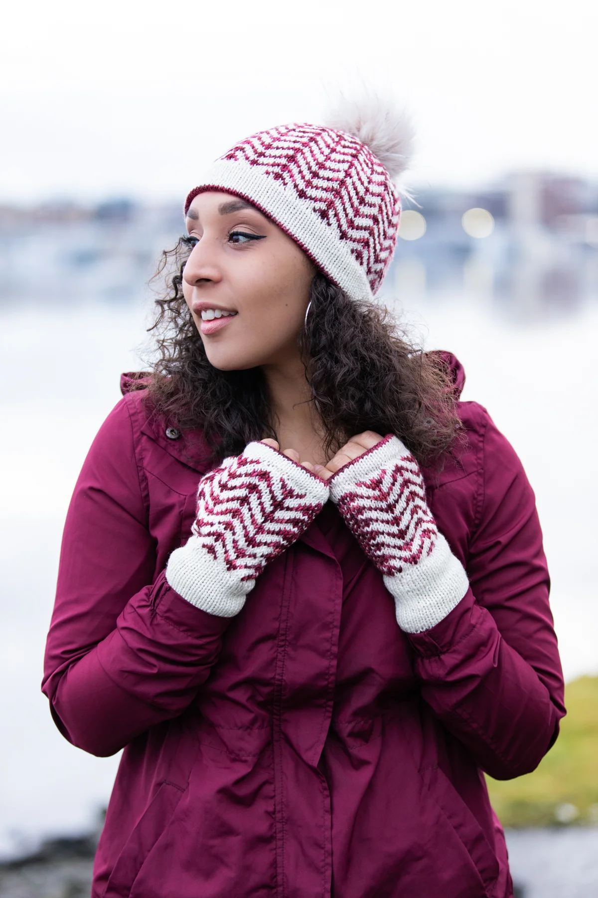 Styled view of the chevron-patterned Novemberist set, a hat and mitt pairing perfect for winter. Doubled edgings and stranded colorwork floats add genuine warmth and comfort while staying practical.