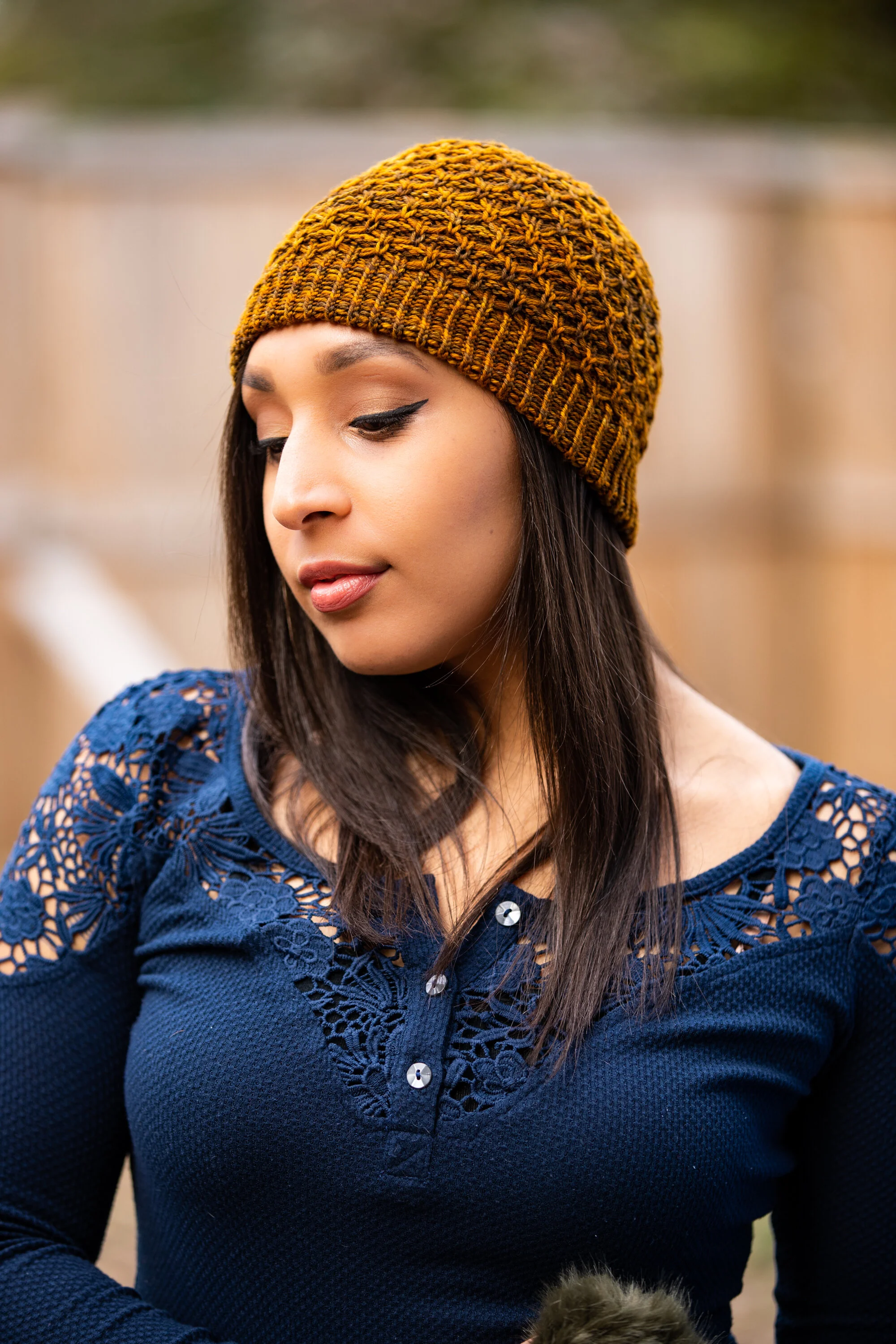 A side view of Aslyn, a textured beanie knit pattern made in a soft and sturdy 4-ply sport/DK yarn. Beautiful in semi-solid & variegated colorways. PDF knitting pattern by Vanessa Smith designs.