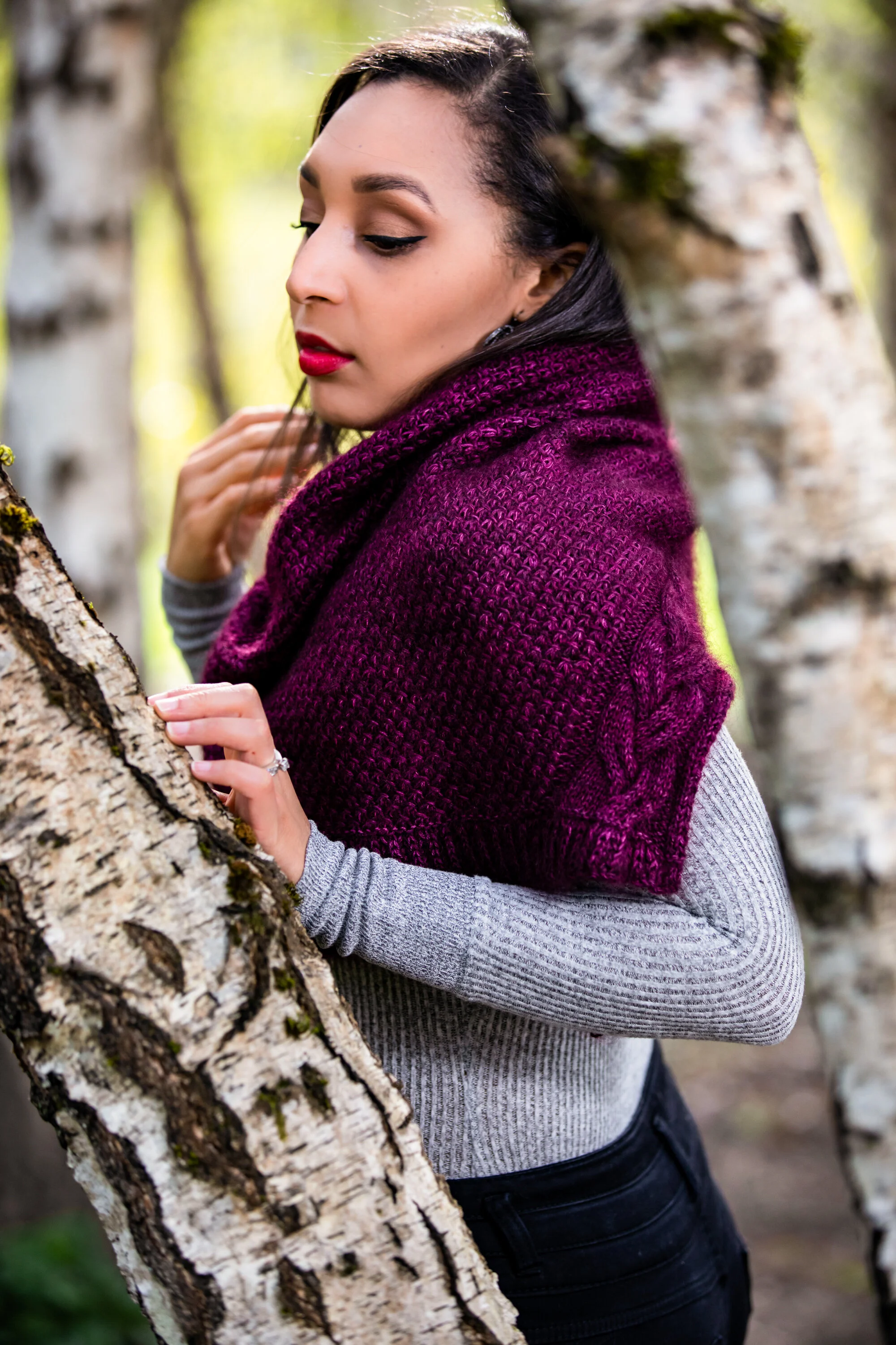 Side profile view of the purple Indira Shawl, showcasing how it elegantly drapes over the shoulder. The perfect, classic combination of warmth and style. PDF knitting pattern by Vanessa Smith Designs.