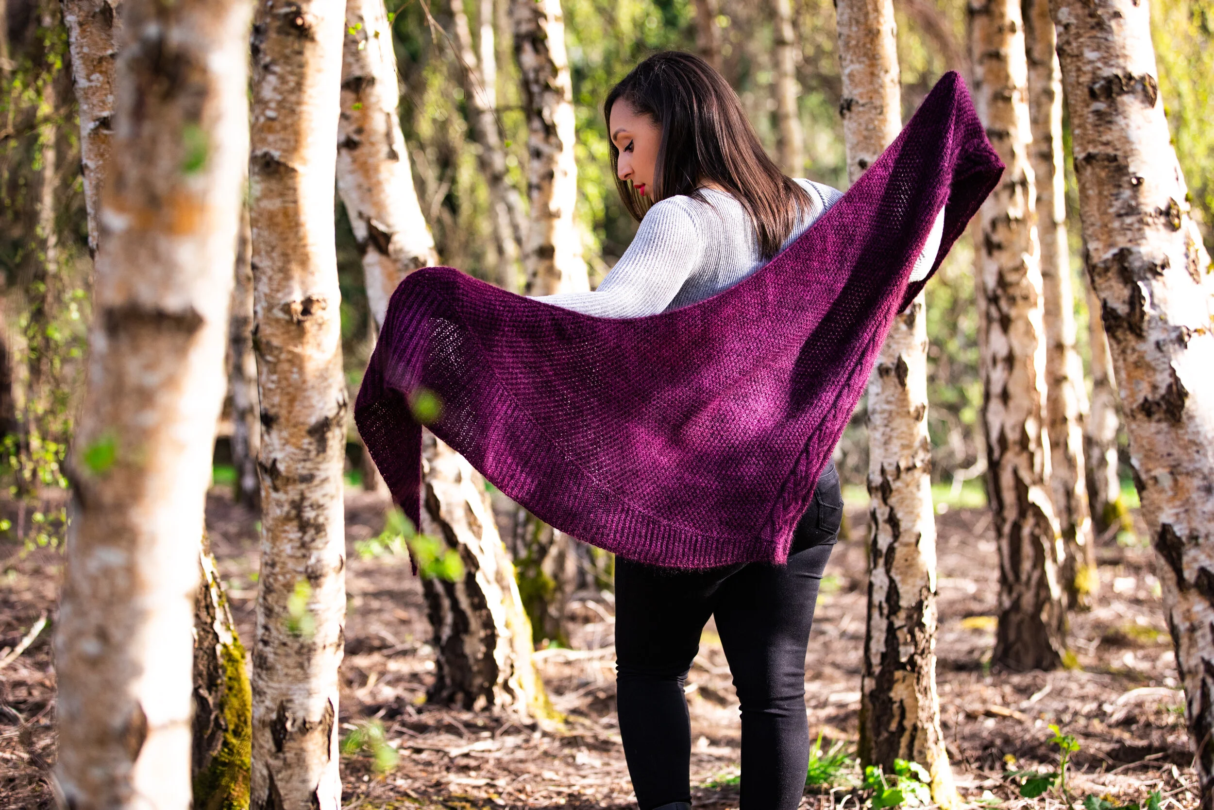 The completed Indira Shawl in purple held open to display its full knitted triangle shape and dimensions. Versatile and cozy size, perfect for layering. PDF knitting pattern by Vanessa Smith Designs.