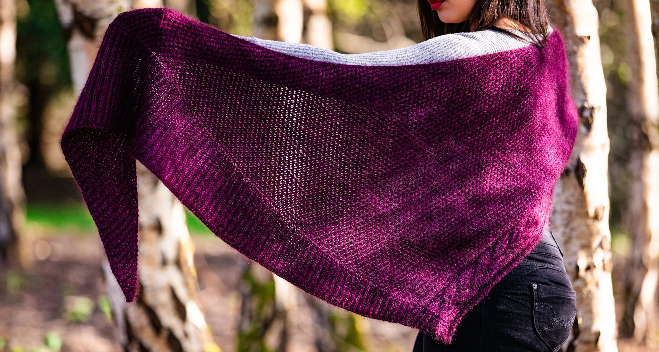 Close-up highlighting the fisherman's ribbed border made with short row shaping in the purple, boomerang-shaped Indira Shawl. The PDF pattern from Vanessa Smith Designs guides you through each step.