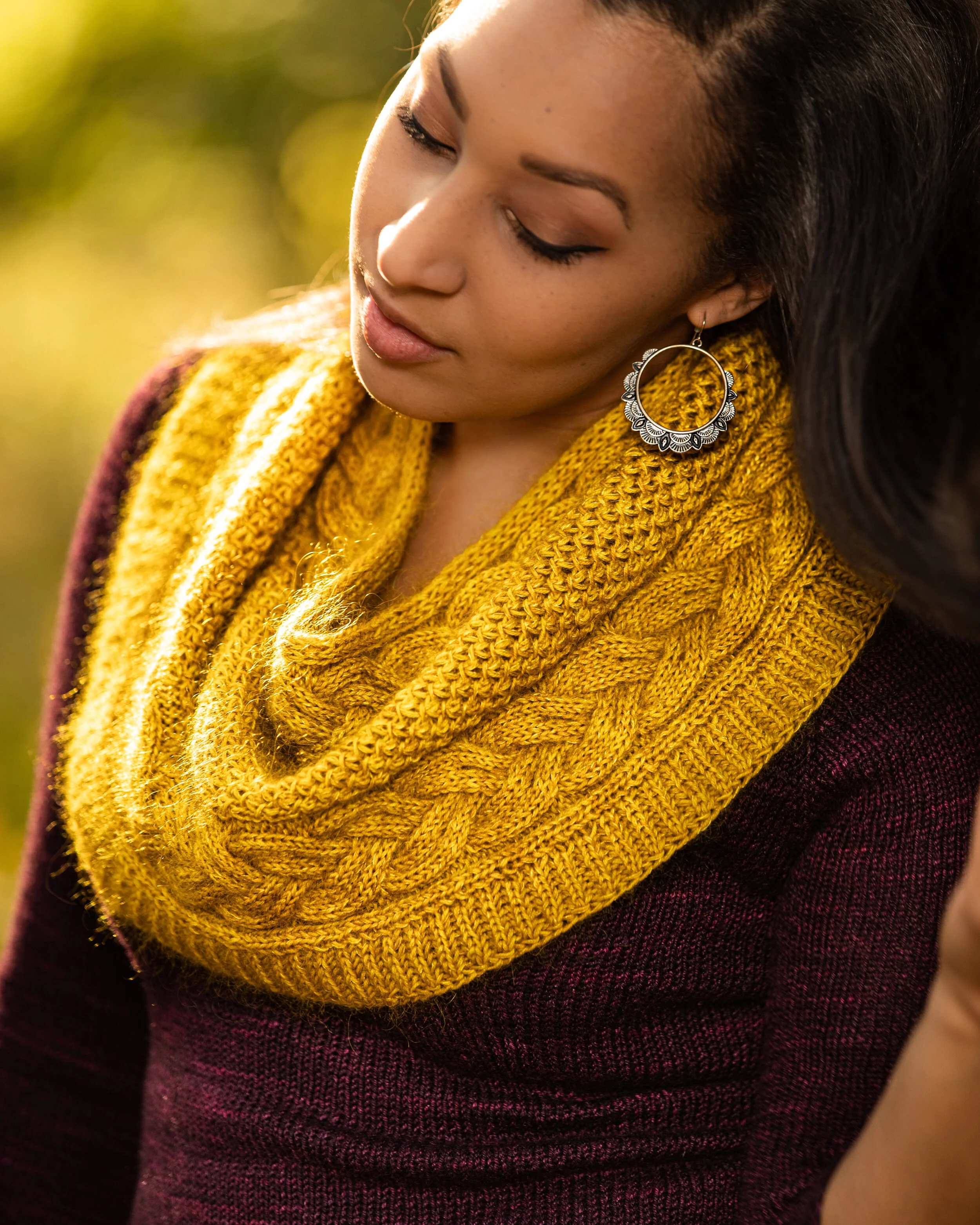 A styled view of the Indira Cowl, handknit in two La Bien Aimee yarns in Yellow Brick Road held together to create a beautiful, squishy scarf. Instant PDF downloadable pattern by Vanessa Smith Designs