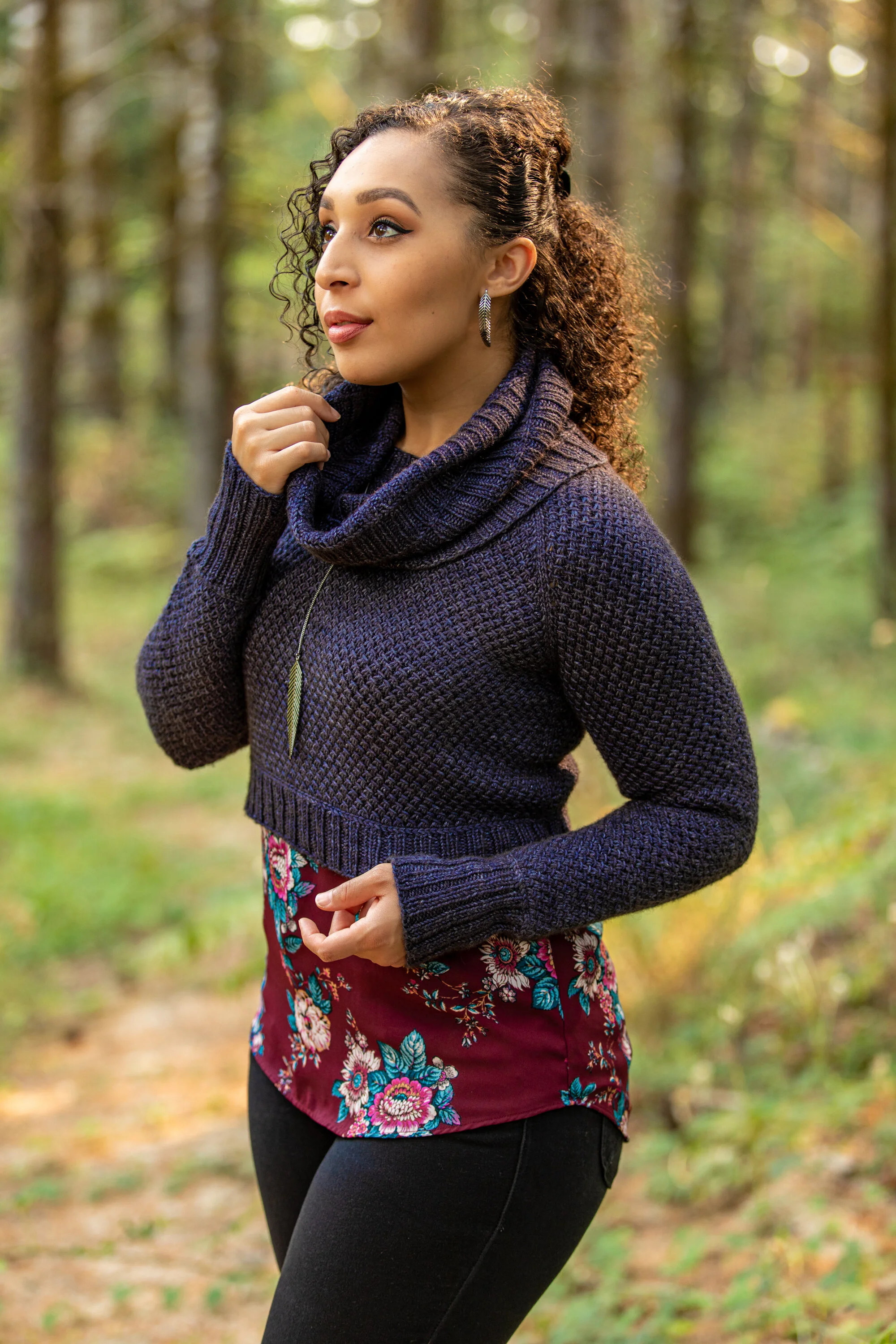 Side profile view of Nydia, a modular knit sweater with a cozy, separate cowl. Plush textured lace with dropped yarn overs paired with classic 2x2 ribbing. Digital pattern download by NessaReneeKnits.