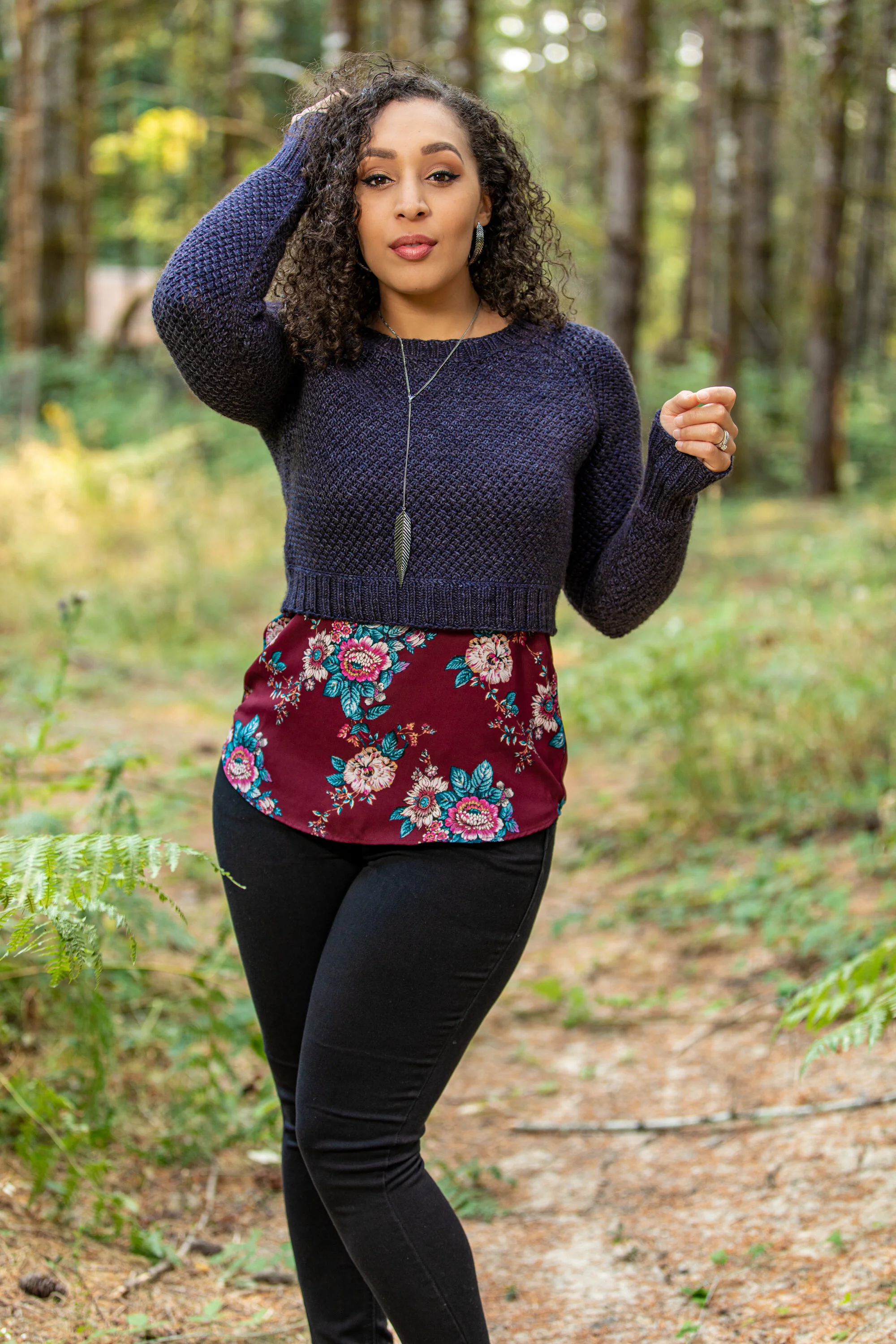 Pacific Northwest-based, BIPOC knitwear designer Vanessa Smith wears the cropped, textured Nydia sweater handknit in a silk, wool, yak blend DK weight yarn. Size inclusive, womens PDF knitting pattern