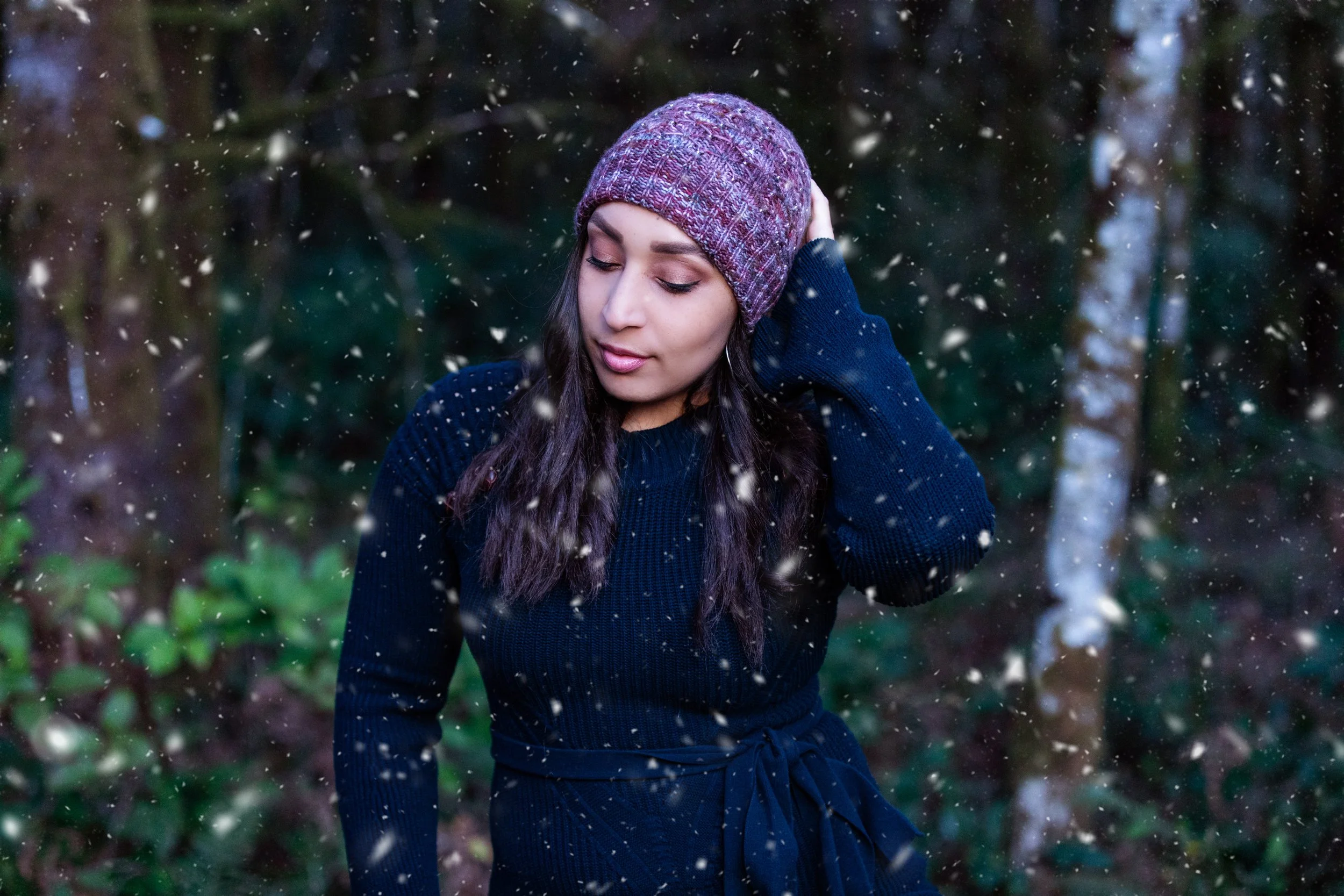 Styled view of Stars Hollow, a unique hat pattern perfect for winter gift-knitting. Fun, easy, and quick to knit with sport weight yarn and clear instructions by BIPOC knitwear designer Vanessa Smith.