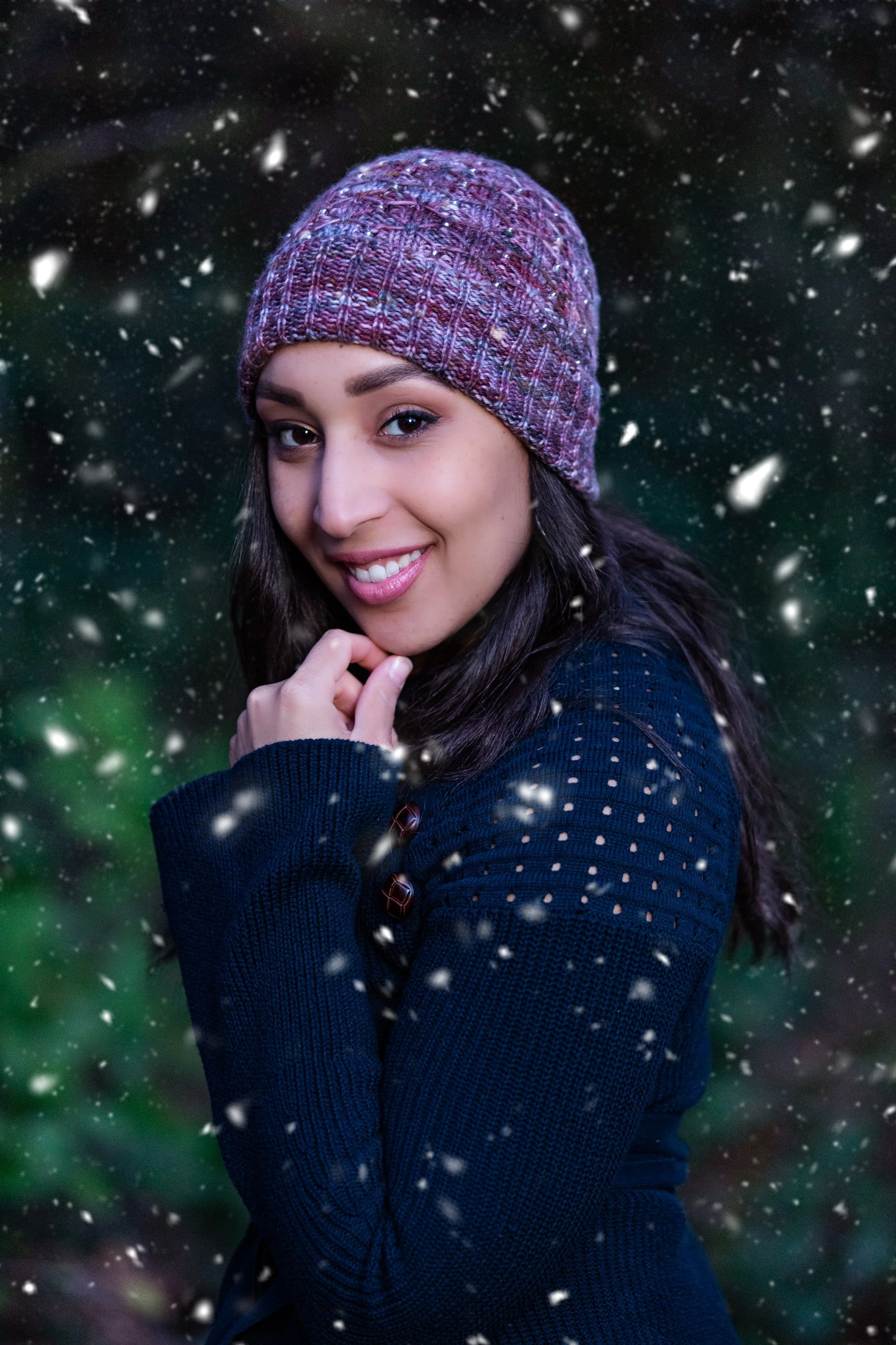 Biracial/BIPOC knitwear designer Vanessa Smith smiles as she wears her Gilmore Girls-inspired hat knitting pattern, Stars Hollow, an easy, quick knit beanie featuring ribbing, beads & slipped stitches