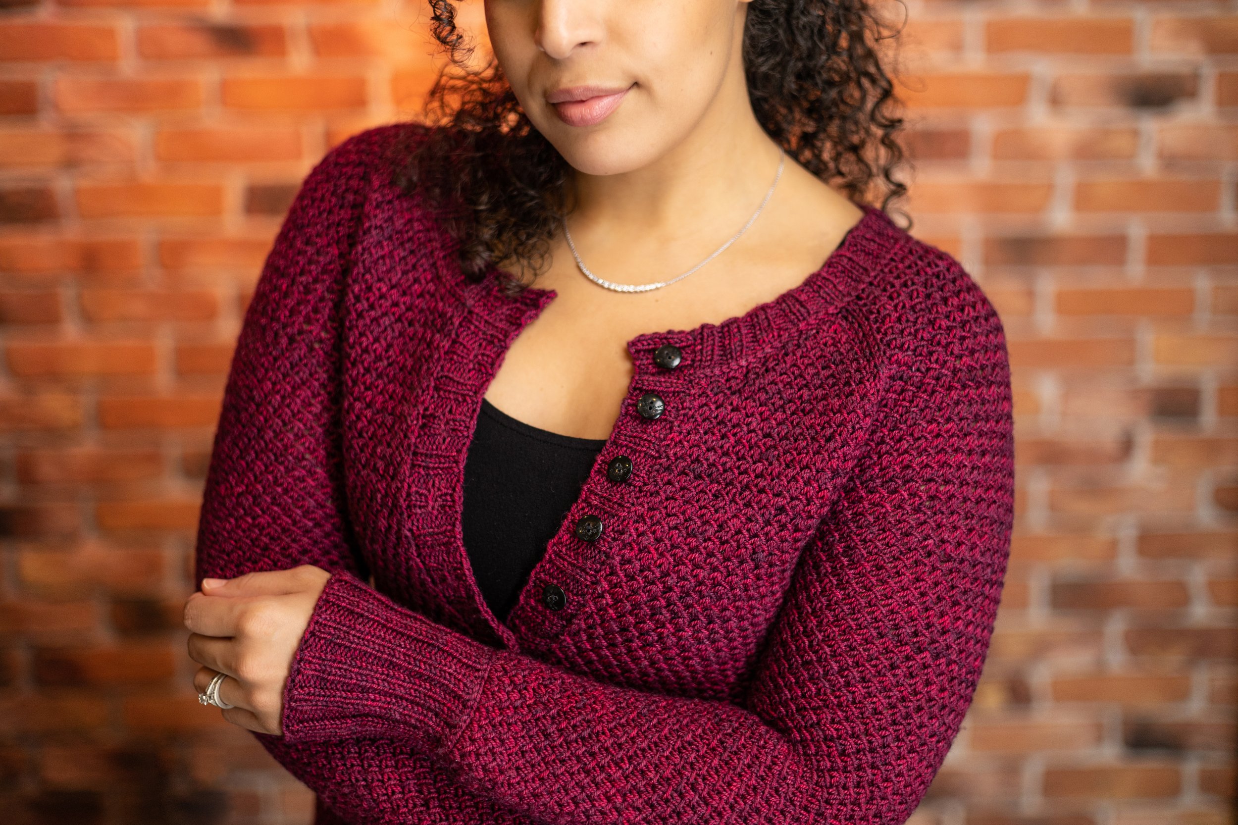 Detailed view of the textured lace stitch featured in the Nydia Cardigan, a paid PDF knitting pattern by Vanessa Smith. Size-inclusive knit worked top down with short rows and compound raglan shaping.