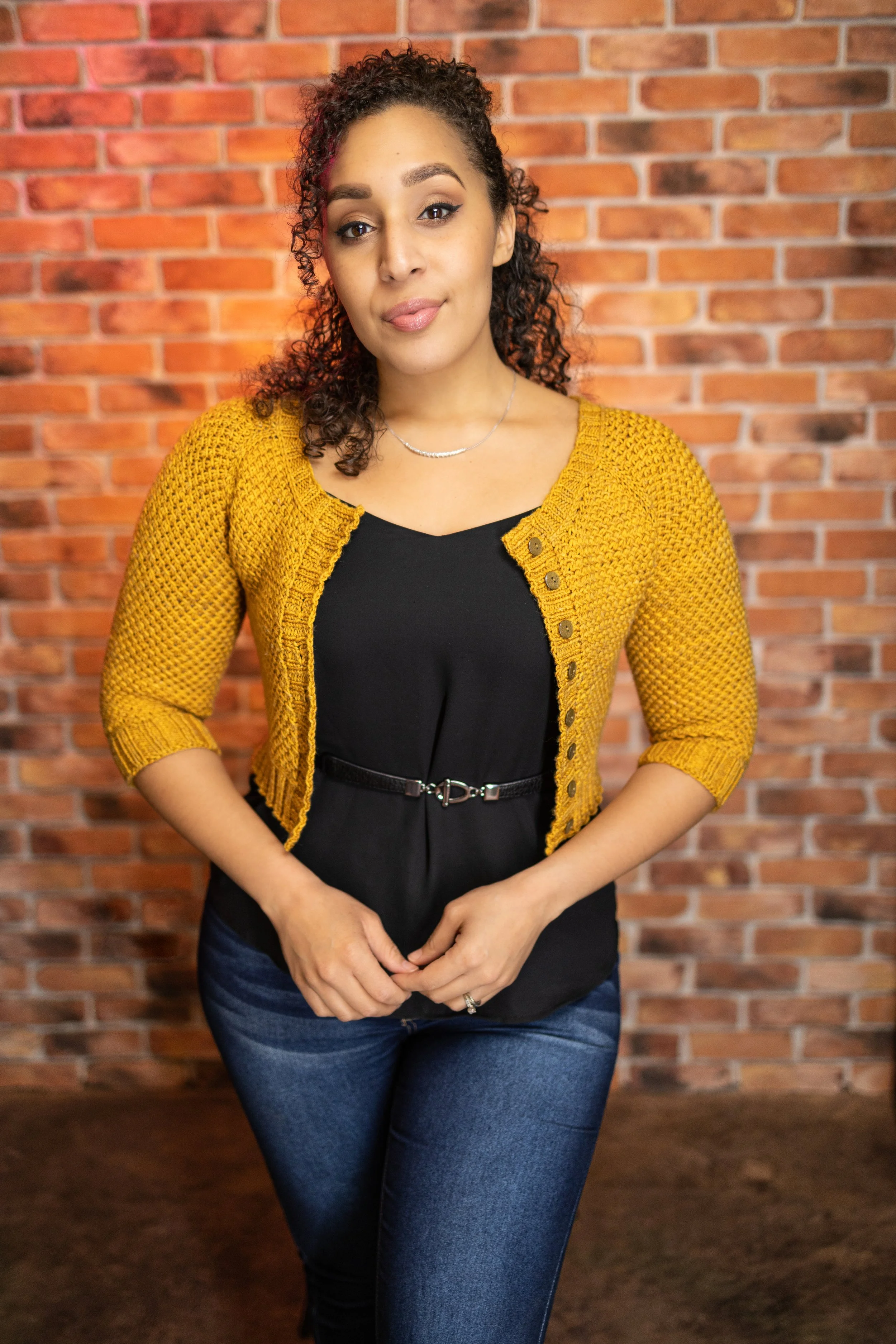 PNW knitwear designer Vanessa Smith wears the chic, cropped-length Nydia Cardigan with 3/4 sleeves in a sunny yellow, perfect for layering over dresses or tops. Paid digital knitting pattern download.