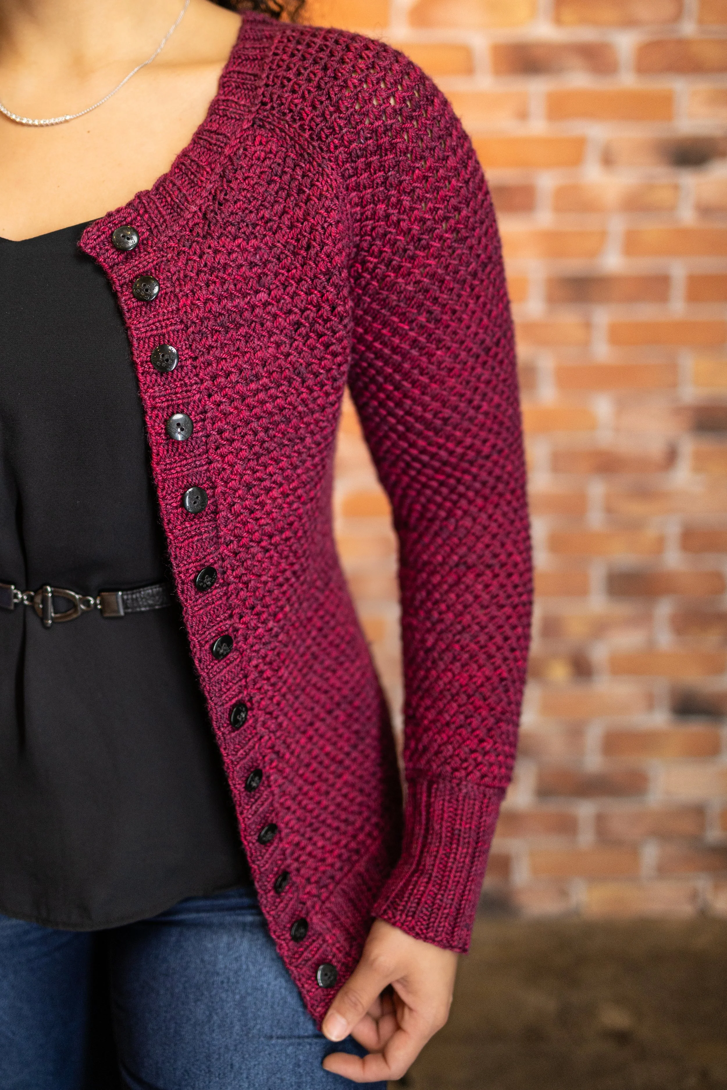 Waist shaping contributes to the feminine, non-boxy fit of the Nydia Cardigan, a top-down raglan by Pacific Northwest knitting designer Vanessa Smith. Short-row neck shaping ensures a comfortable fit.