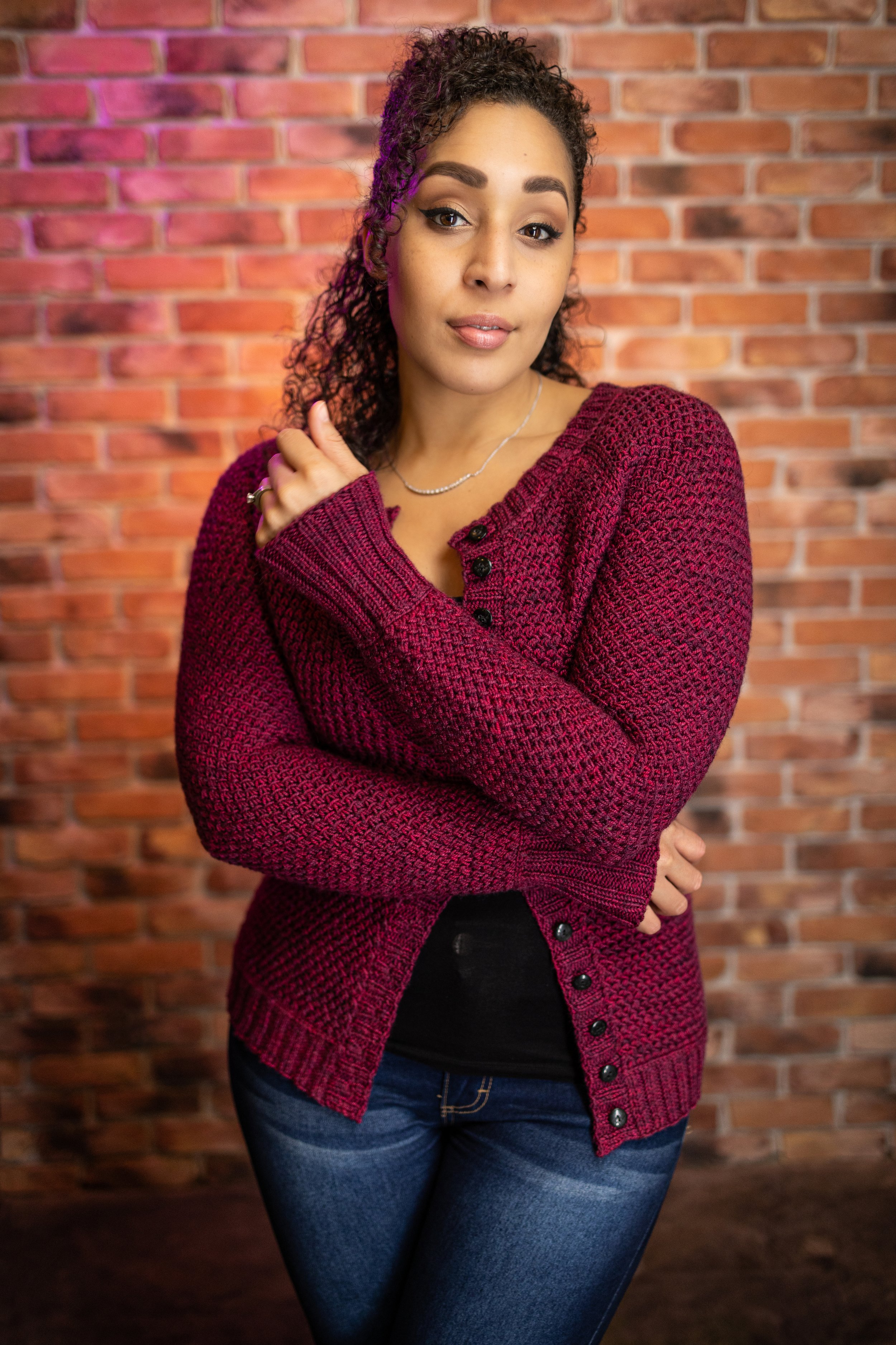 Styled view of the Nydia Cardigan, a top-down, customizable raglan  designed for curvy women. This well-fitting, classic knit pattern by Vanessa Smith is perfect for fall layering and office wear.