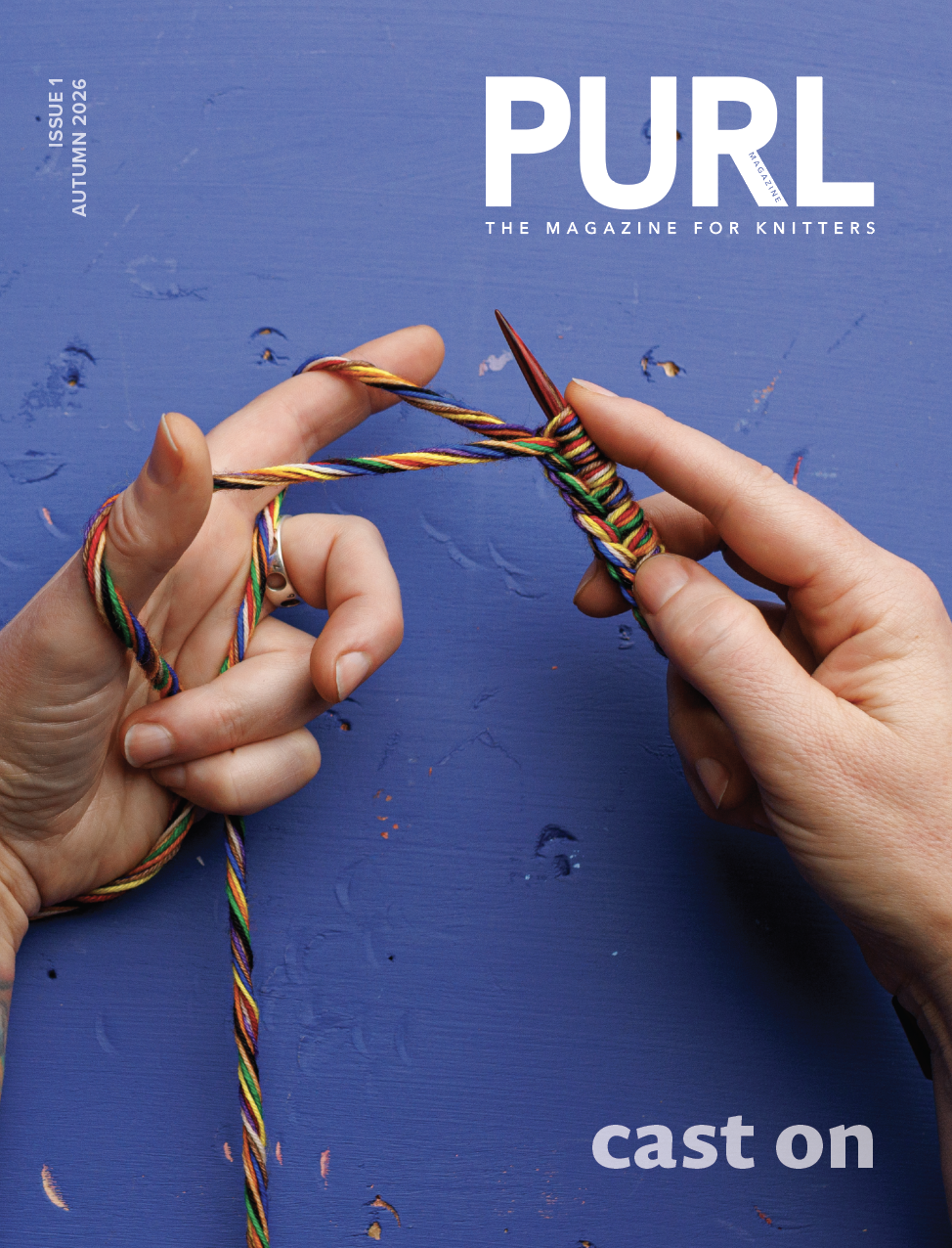 Cover of PURL Magazine, Issue 1, Cast On, Autumn 2026, brought to you by the editors/directors of PLY and WEFT Magazines. Two hands hold rainbow-colored yarn while working a long-tail cast on.