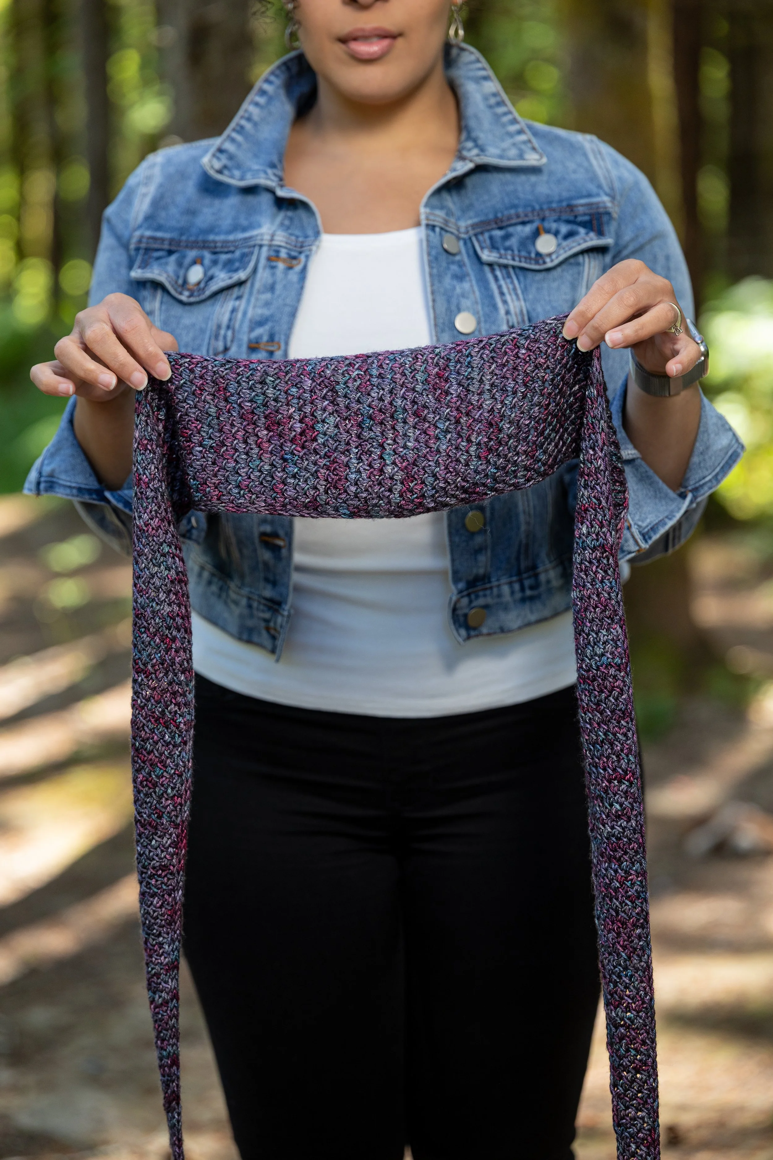 Tipping Point Scarf shown in the skinny scarf size and a variegated, DK weight yarn. A tidy i-cord edge frames an easy, addictive textured lace stitch knit from tip to tip using increases & decreases.