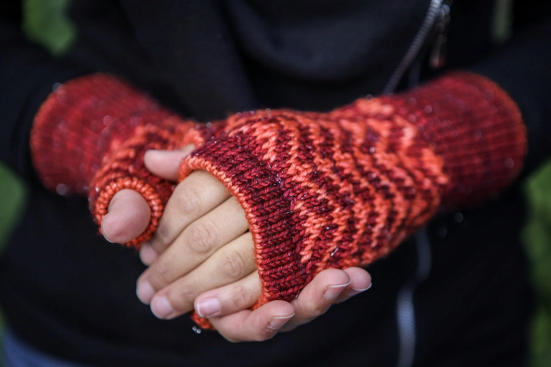 Top view of Novemberist Mitts knit in an inverse, bold color combination and DK weight, stellina yarn. Turned cuffs and finger edgings make these fair isle fingerless gloves toasty and comfortable.