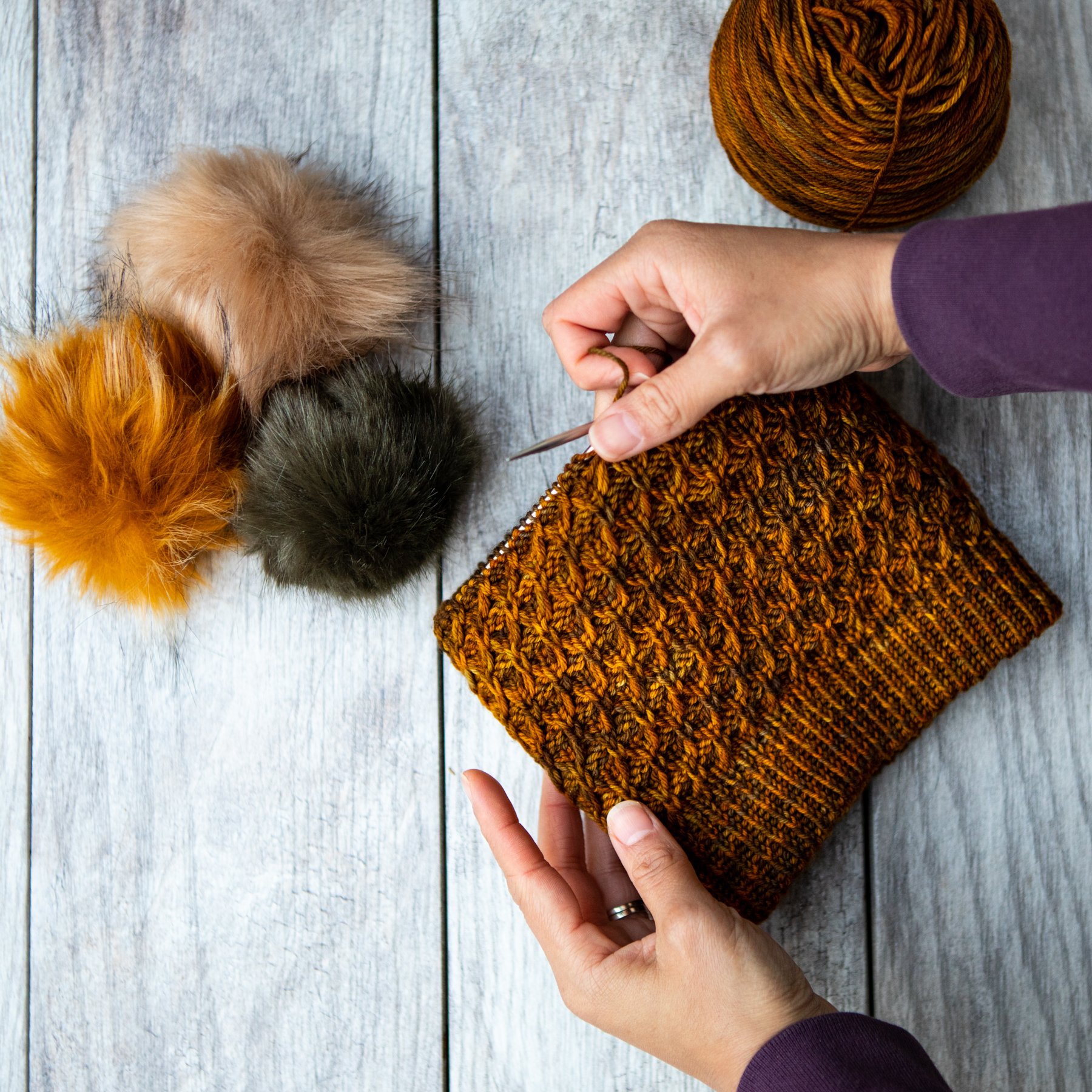 Progress shot of Aslyn, a double-brimmed hat knit in sport weight yarn on 16" (40 cm) circular knitting needles beginning with a chained provisional cast on. A quick knit with easy all-over textures.