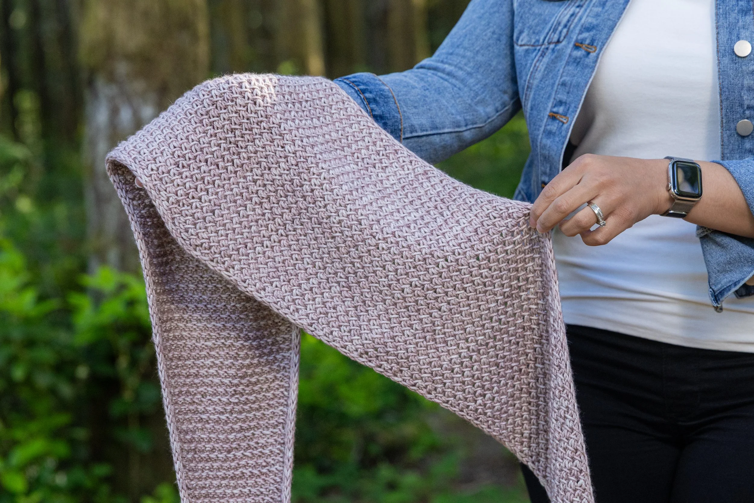 Tipping Point Scarf in beige showing i-cord edge detail, textured lace stitch, and triangular shaping worked sideways with Aran weight yarn. A beginner-friendly two-skein small shawl knitting pattern.