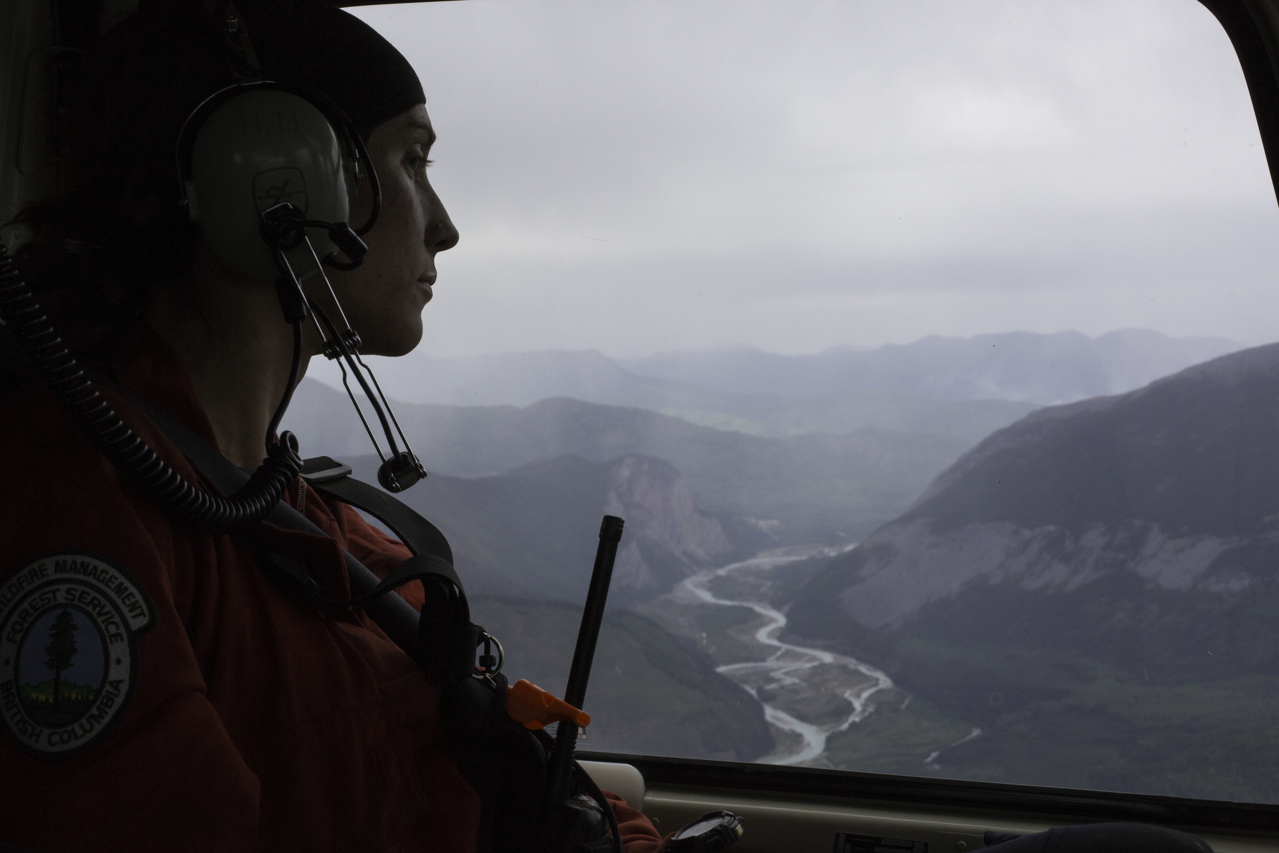 Jess watching the world slide by. An hour long flight from Toad River back to Fort Nelson.
