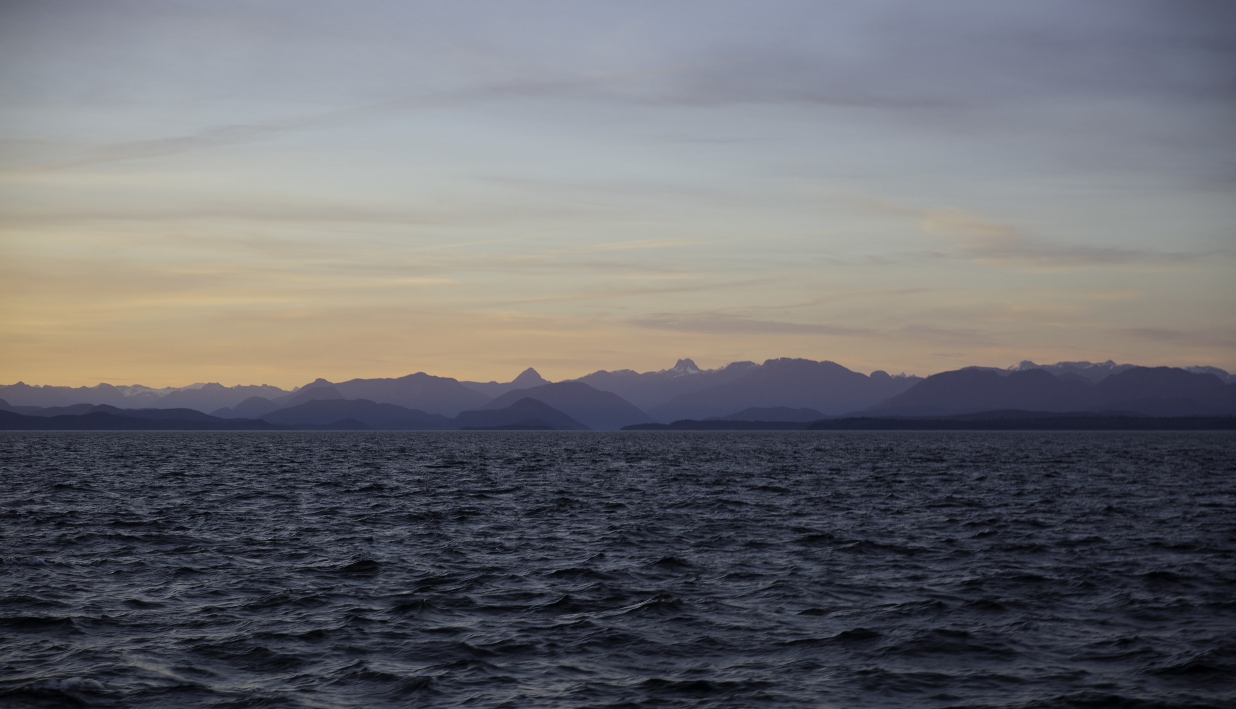A palette of colours plays with the Coast Mountains off to the east.