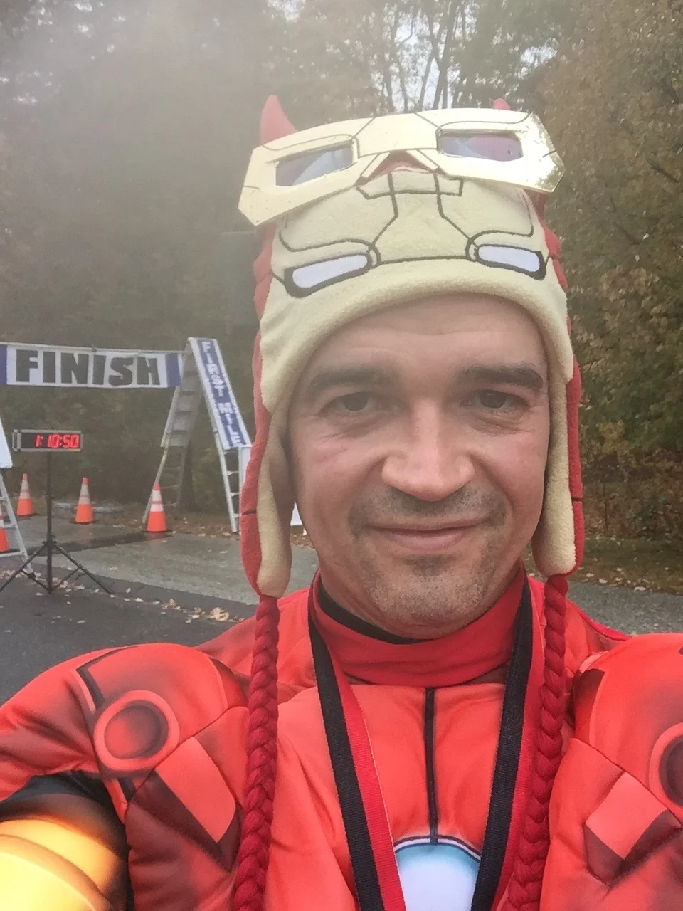 The Running Obstetrician Iron Man celebrating a great run at the finish line.