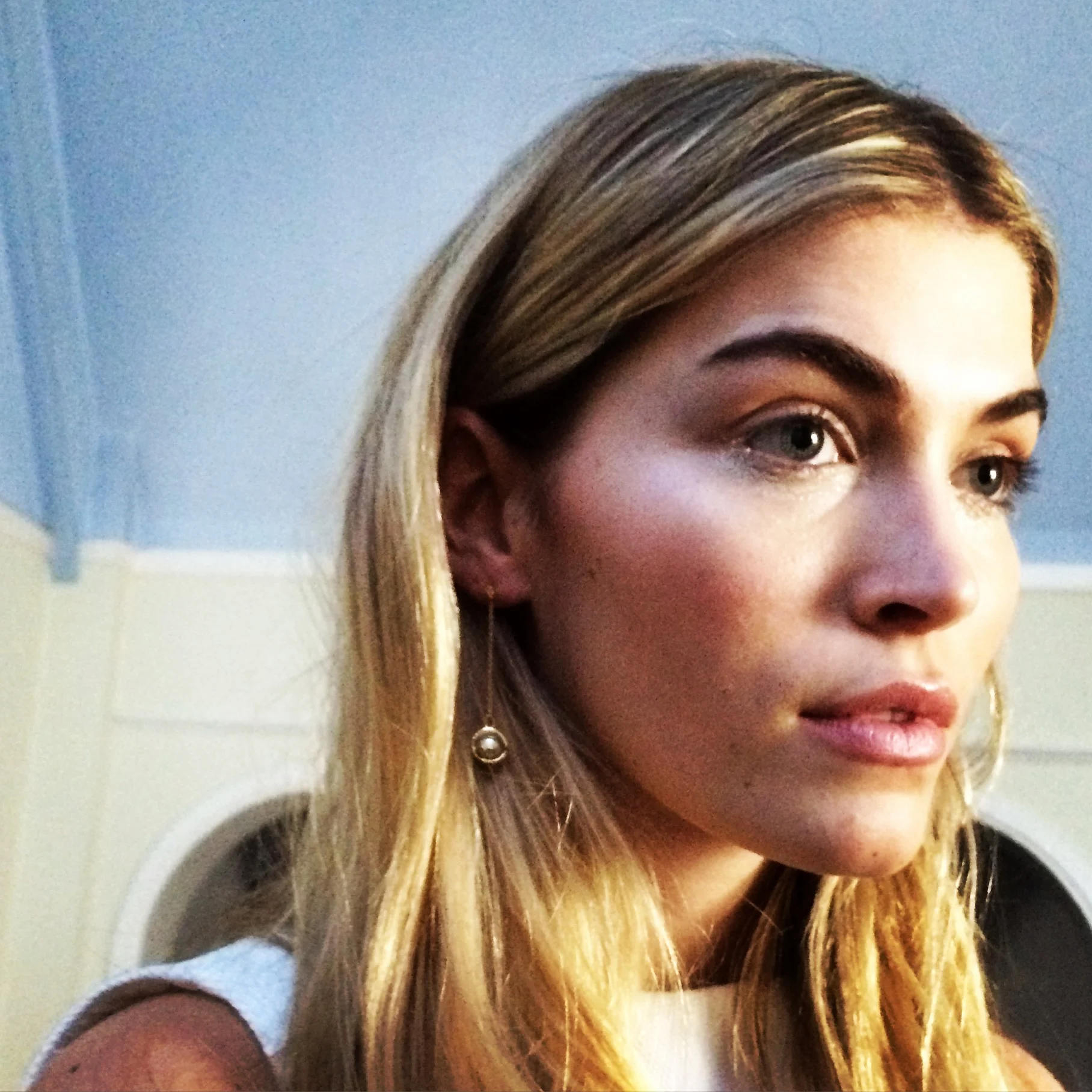 Beautiful Coco wearing Laika earrings .