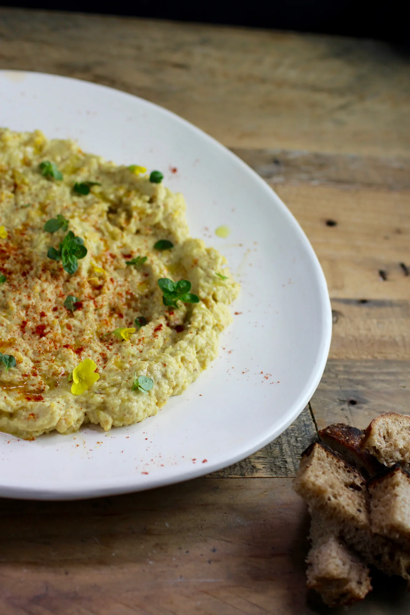 Rustic bread or crackers from whole grains or crisp raw vegetables are a great way to dip up this spread.