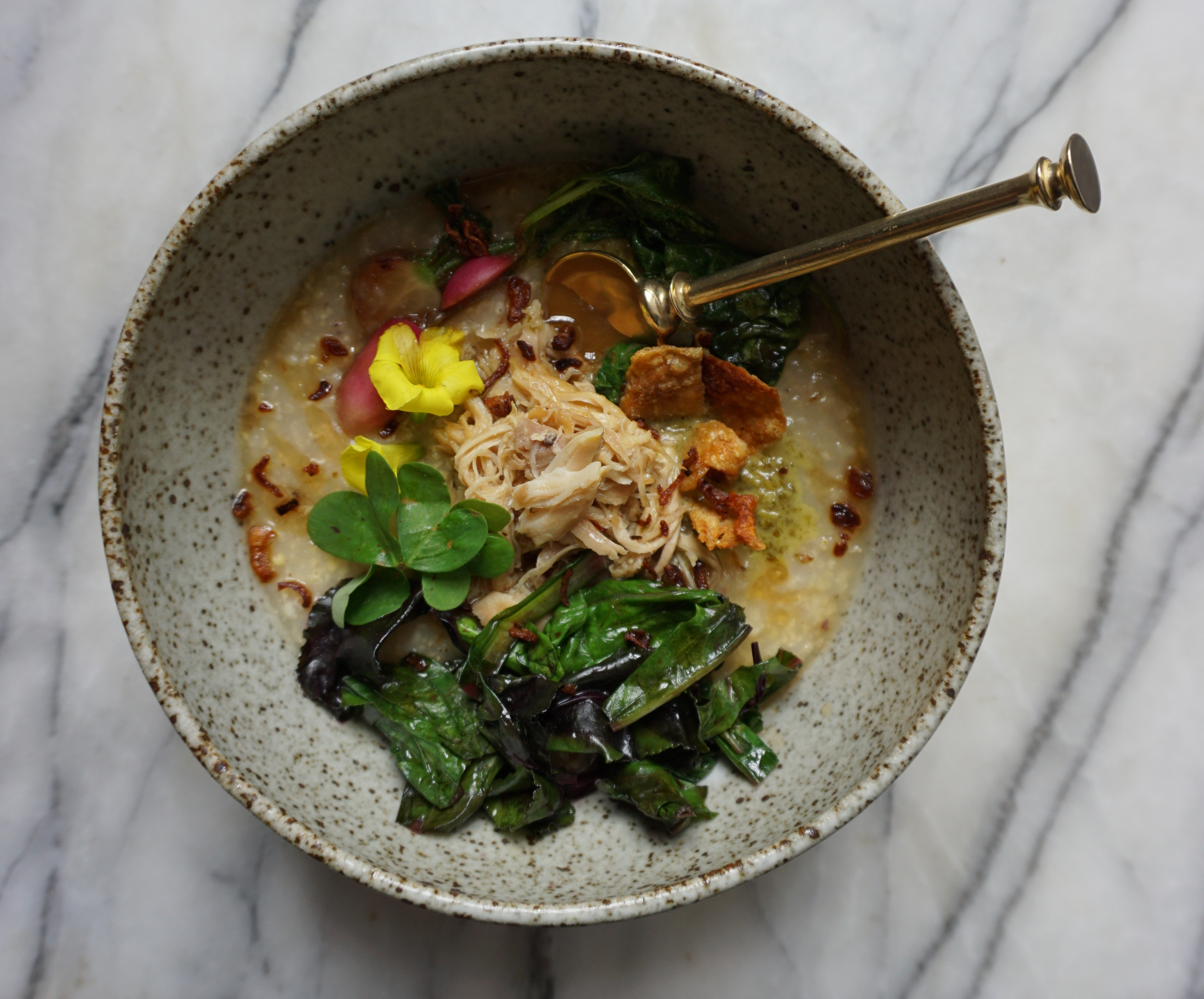 The - now classic - millet and chicken tamari porridge with seared radish and wood sorrel sauce.