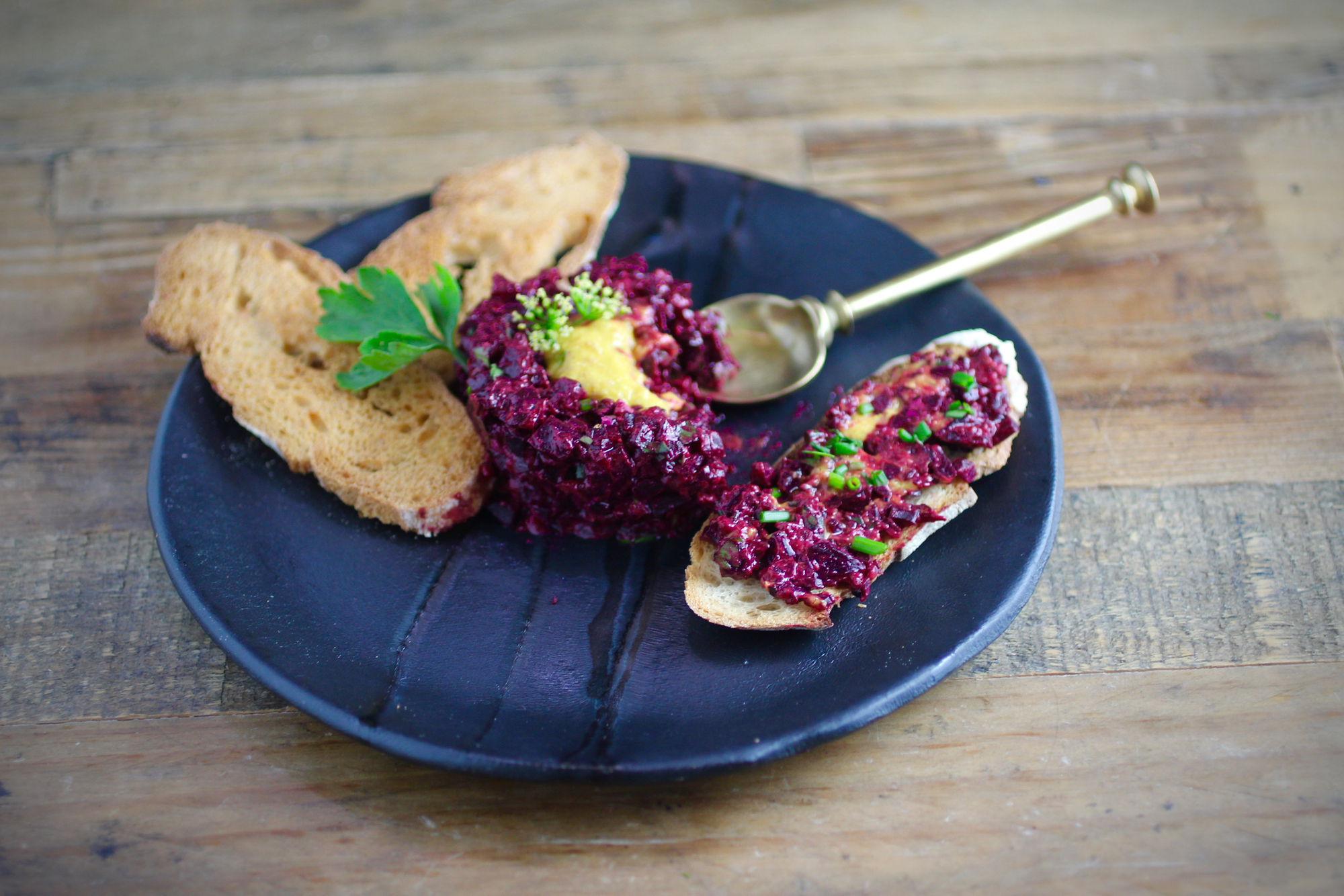 Spreading beet tartare on baguette crisps. The above is 1/2 of the recipe.