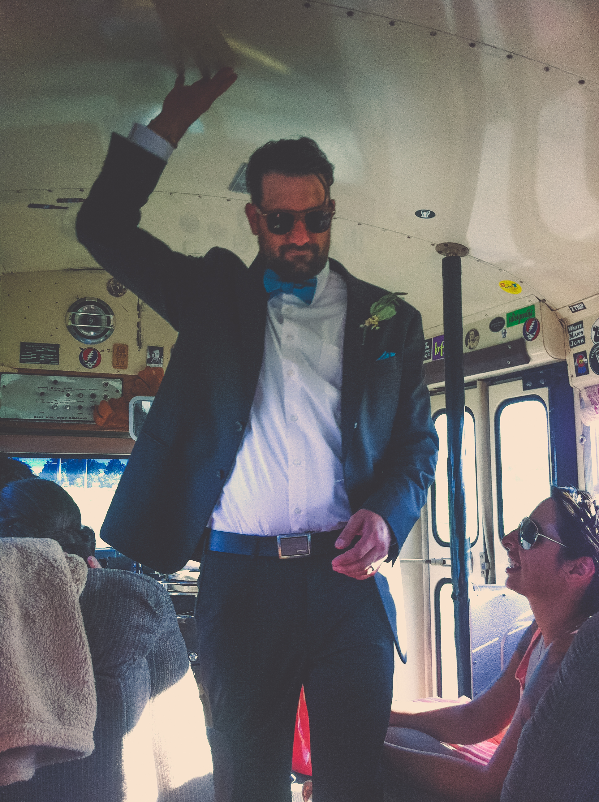 Max on the party bus from the ceremony site to the reception. A married man.