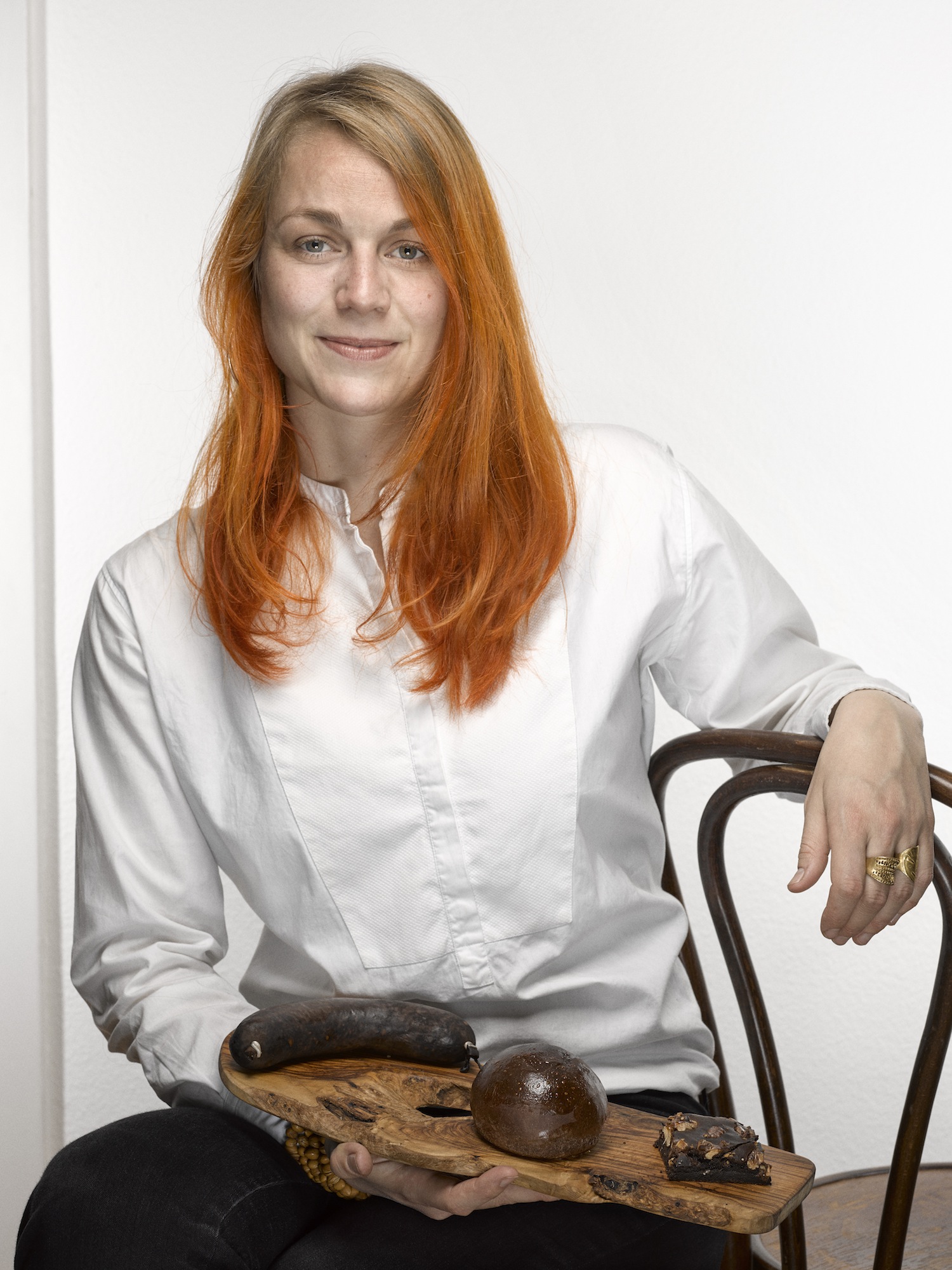 Laura with a smoked blood sausage, blood brioche and blood brownies, April 2016, Gerber Loesch Photography
