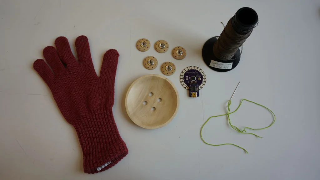 Step 1: Materials Necessary - Glove, LilyPad Arduino, 1Pink LED, Conductive Thread, Colored Threads, Buttons