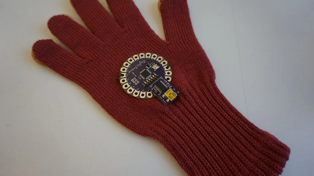 Step 3: Sewing a LilyPad with a normal thread for attaching on the glove.