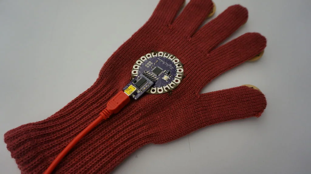 Step 4: ewing conductive threads on each finger to the LilyPad.
