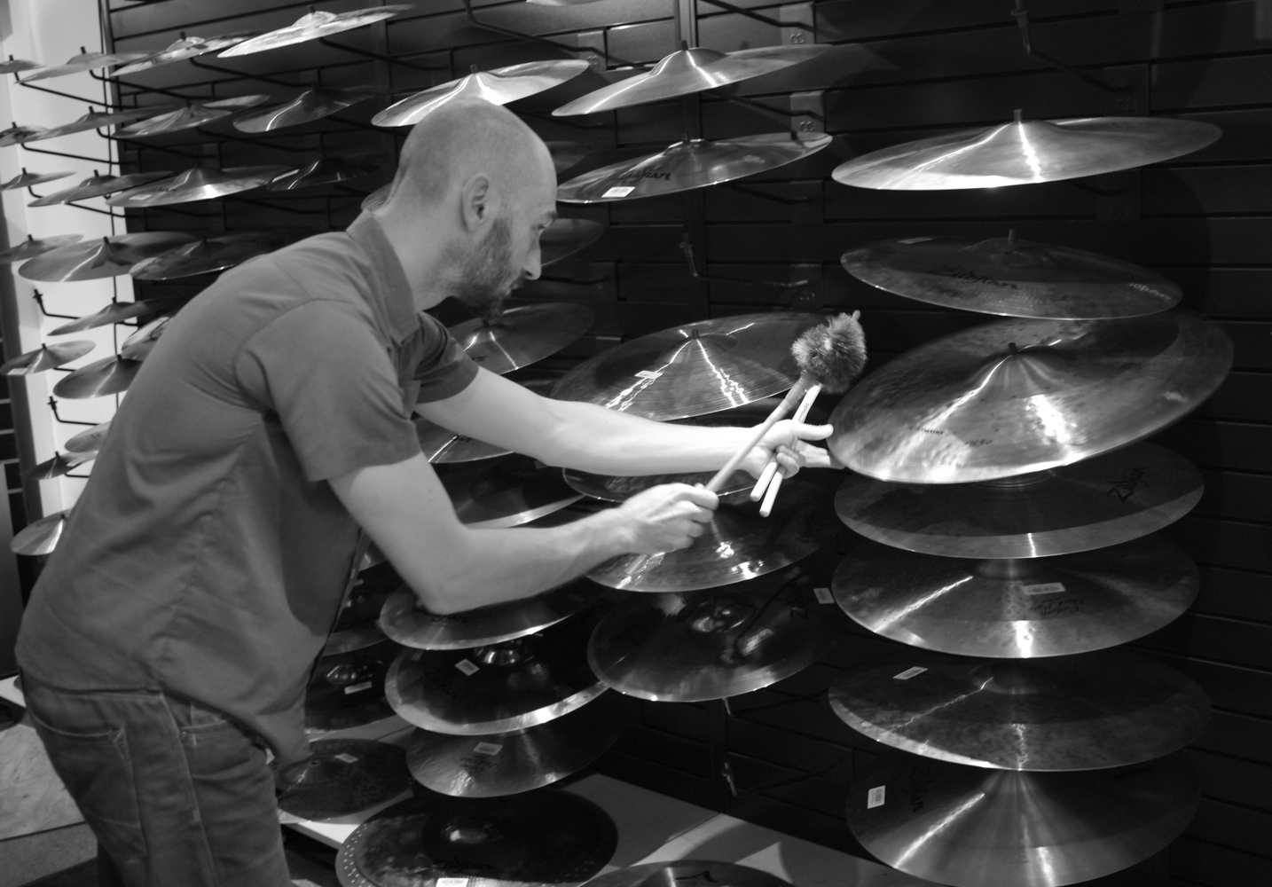 Testing and selecting cymbals at Klangfarbe music shop for the creation of CYMBAL ROLLS
