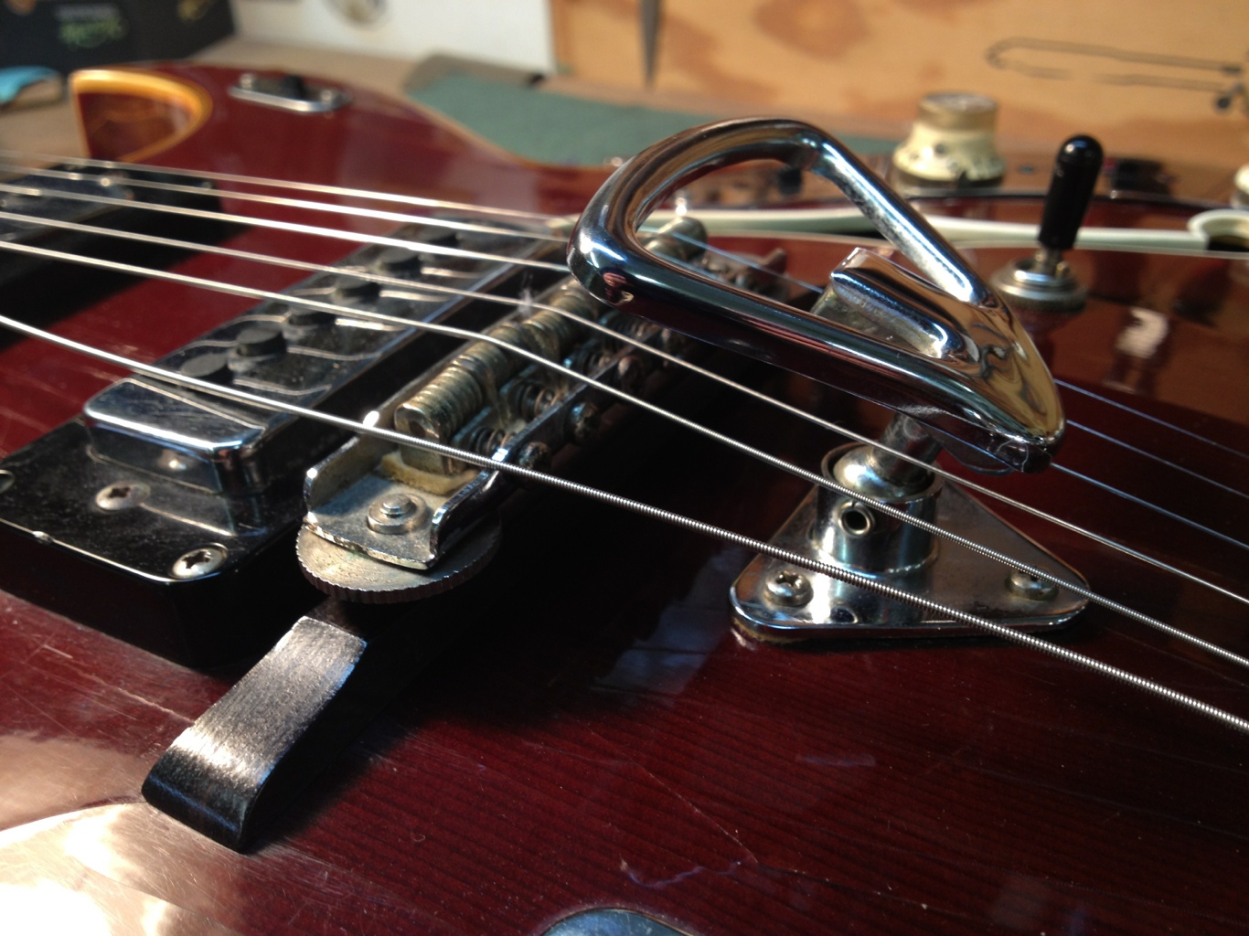 Hand operated wah behind the bridge.