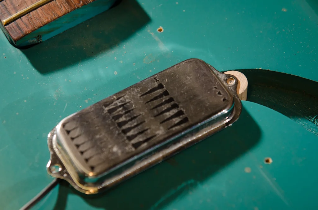 Yet another view of the pickup mounting dowel to secure the pickup.