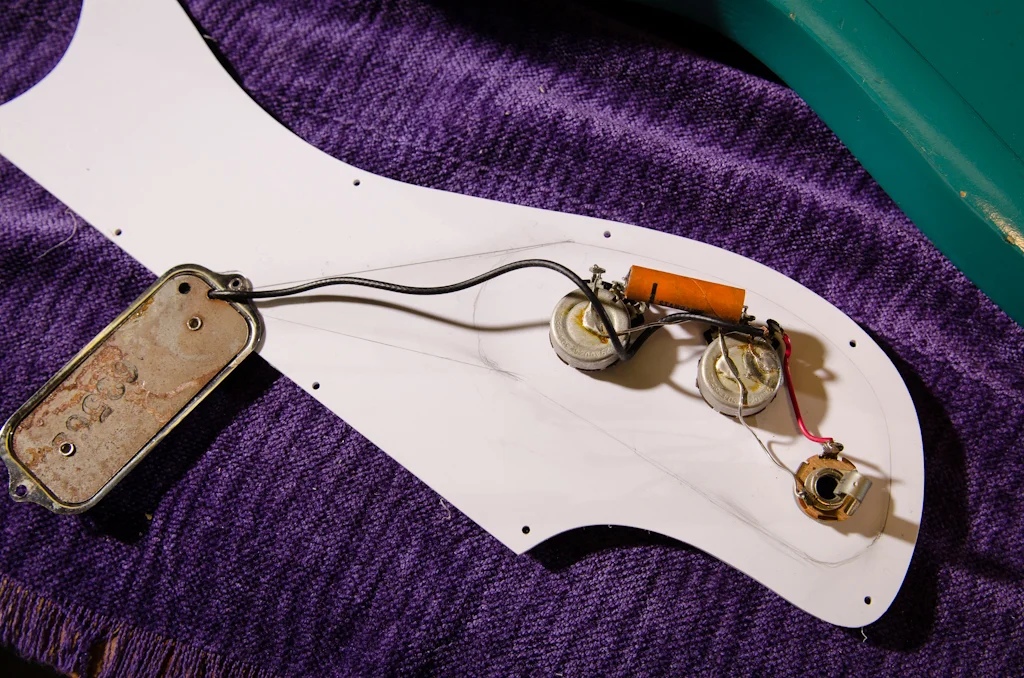 The output jack is rewired. Note that I traced around the controls to layout the new control cavity that will have to be routed into the body.